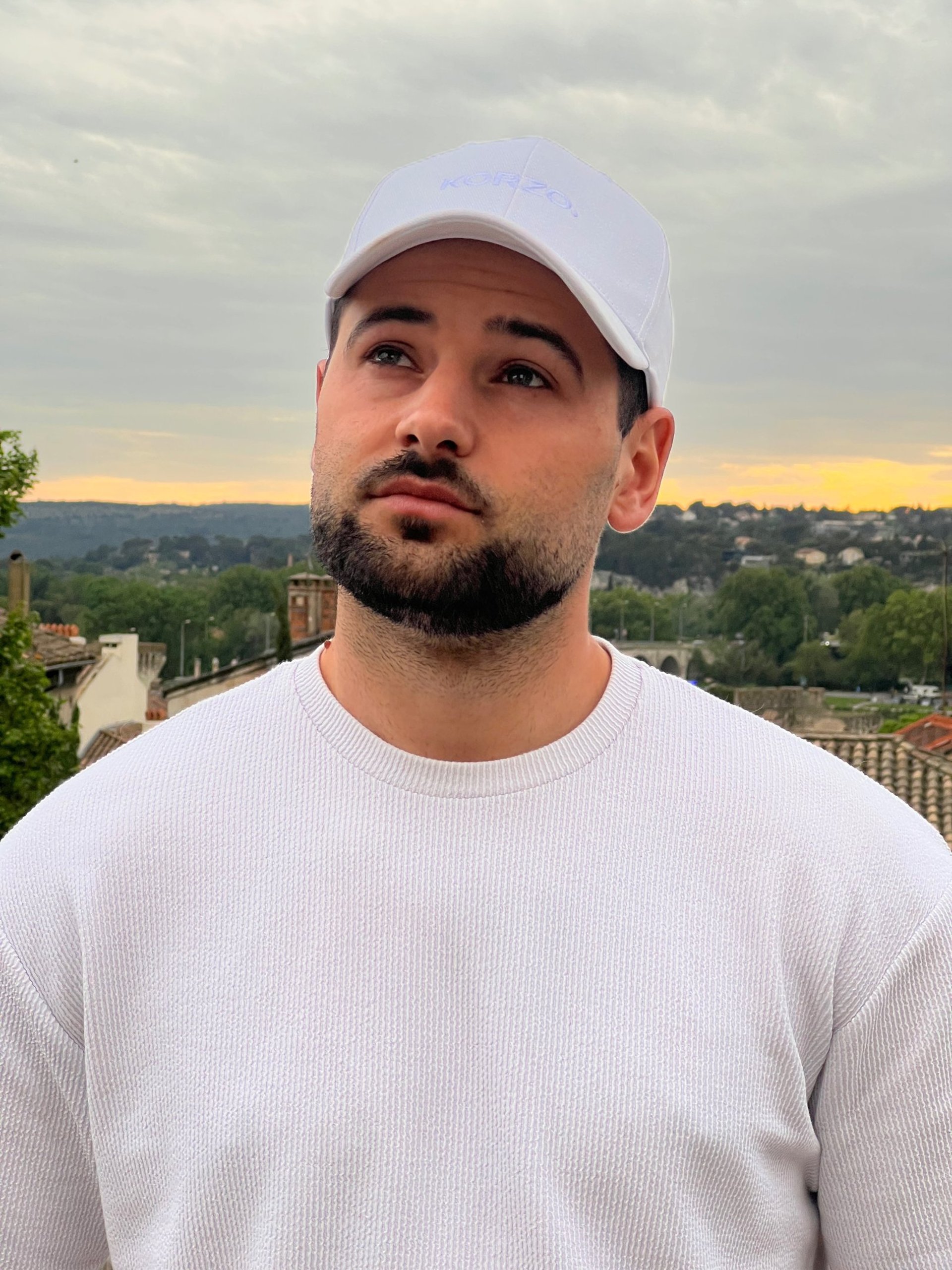 an abstract photo of a curved building with a blue sky in the background