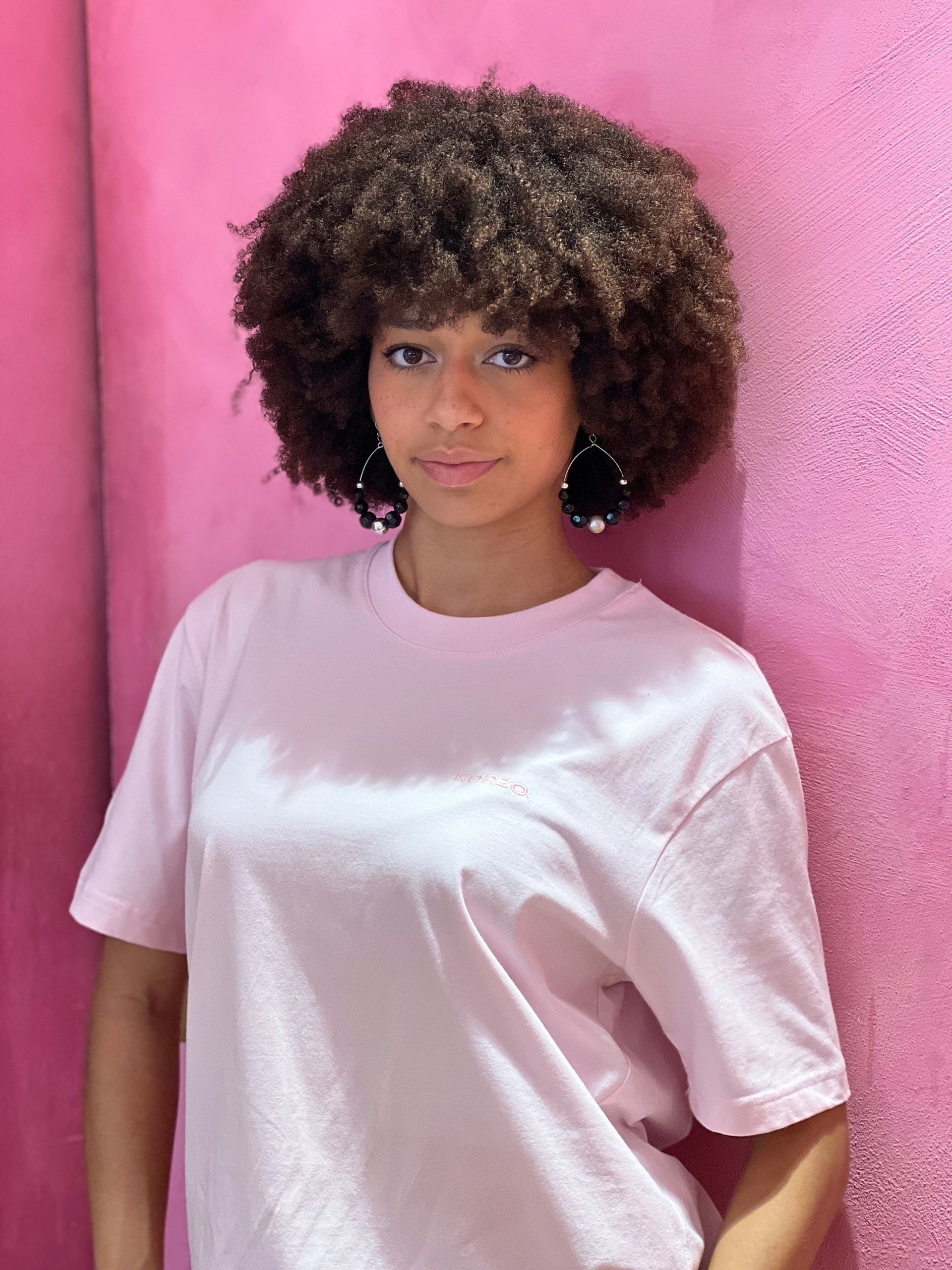 an abstract photo of a curved building with a blue sky in the background