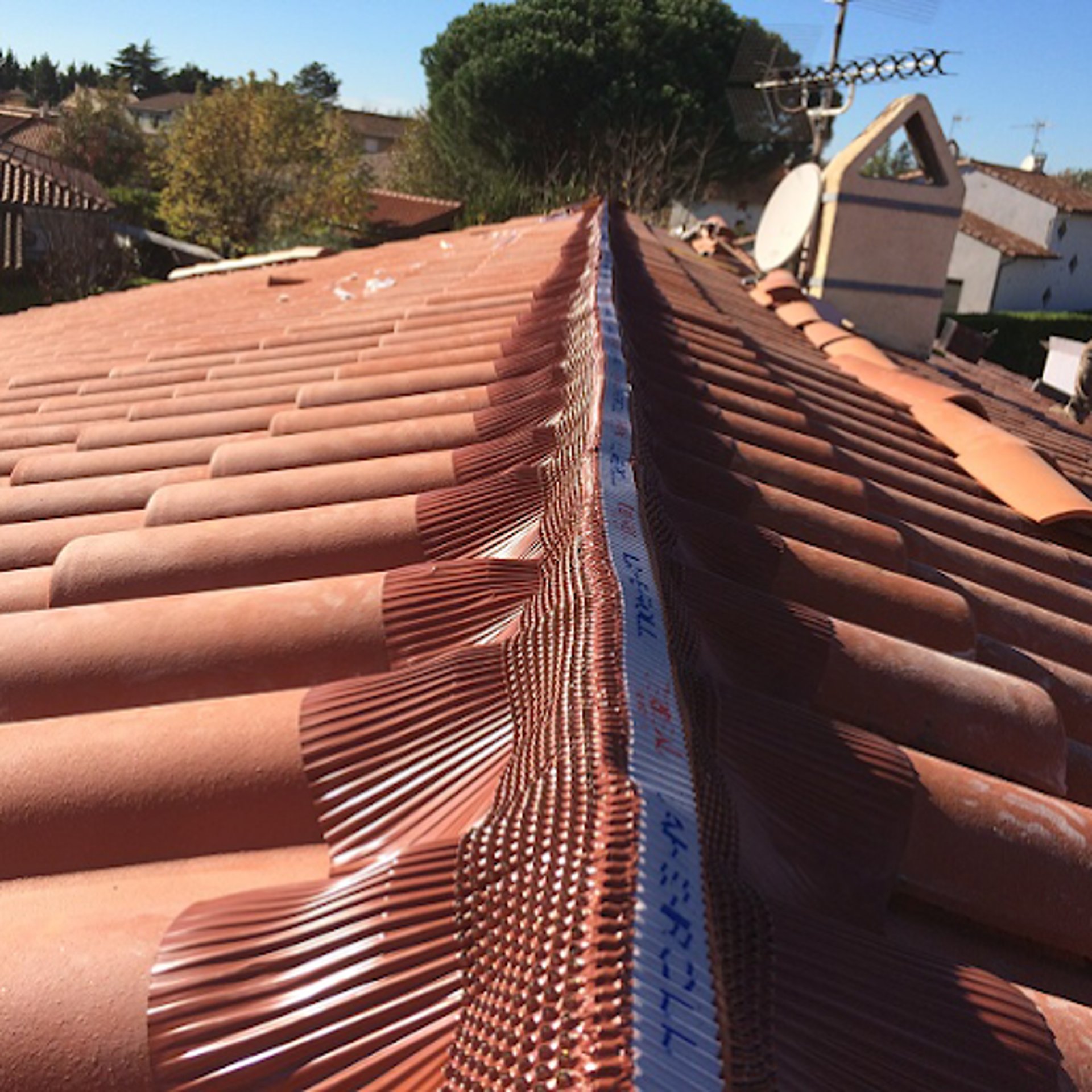 A man on a roof working on a roof