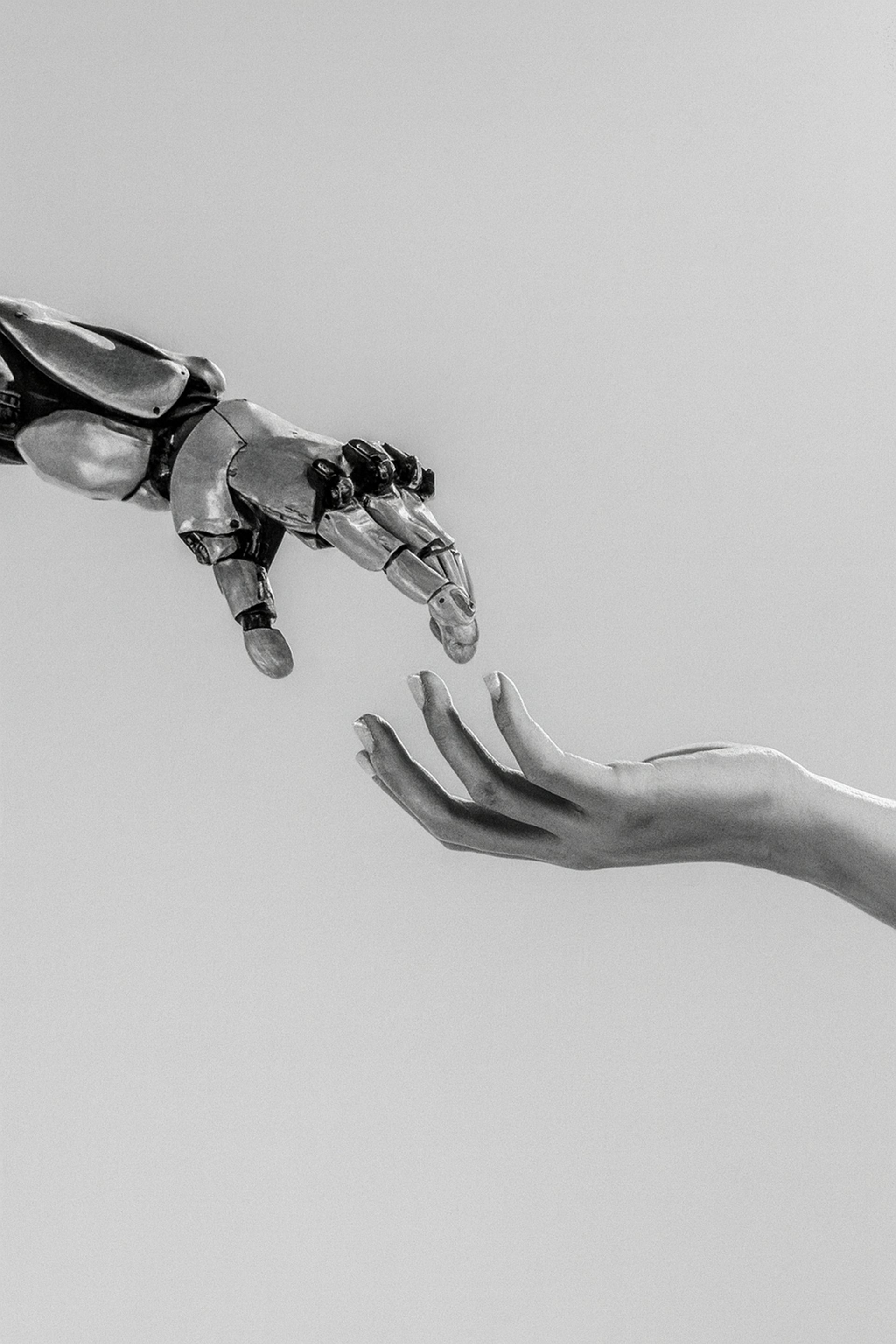 two hands reaching for a flying object in the sky