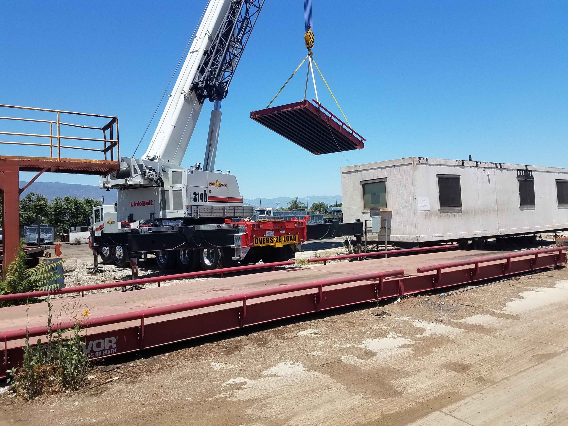 an abstract photo of a curved building with a blue sky in the background
