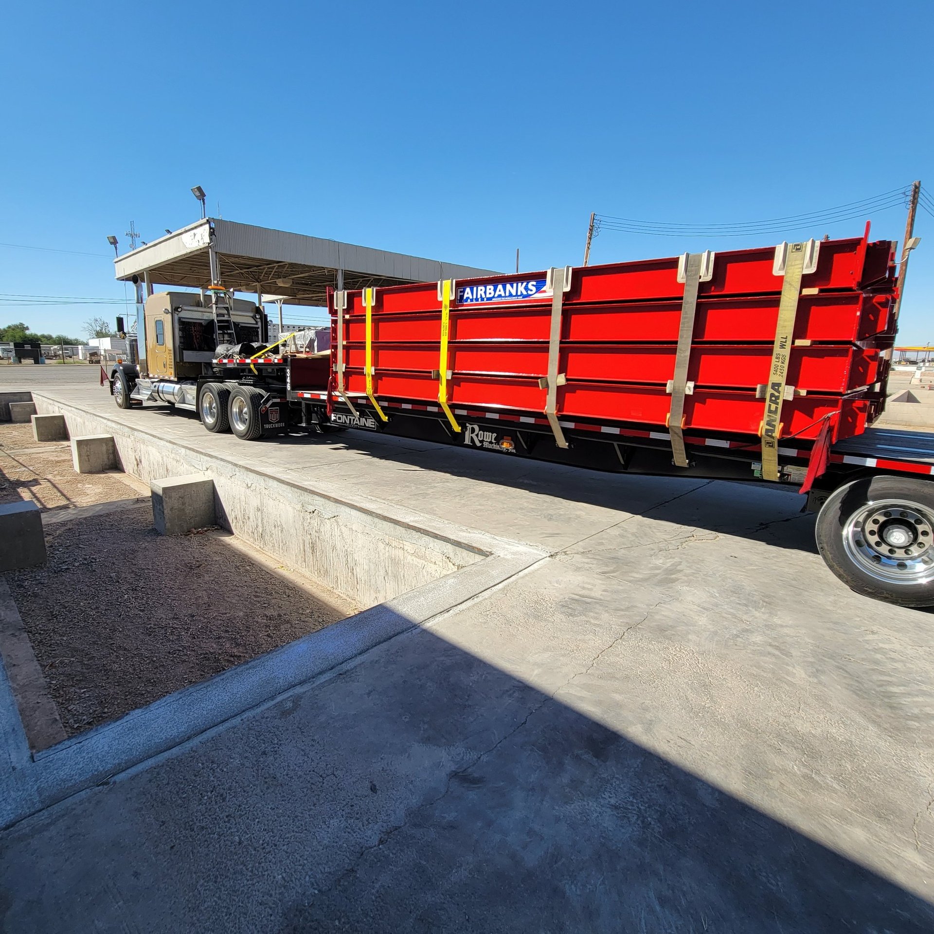 an abstract photo of a curved building with a blue sky in the background
