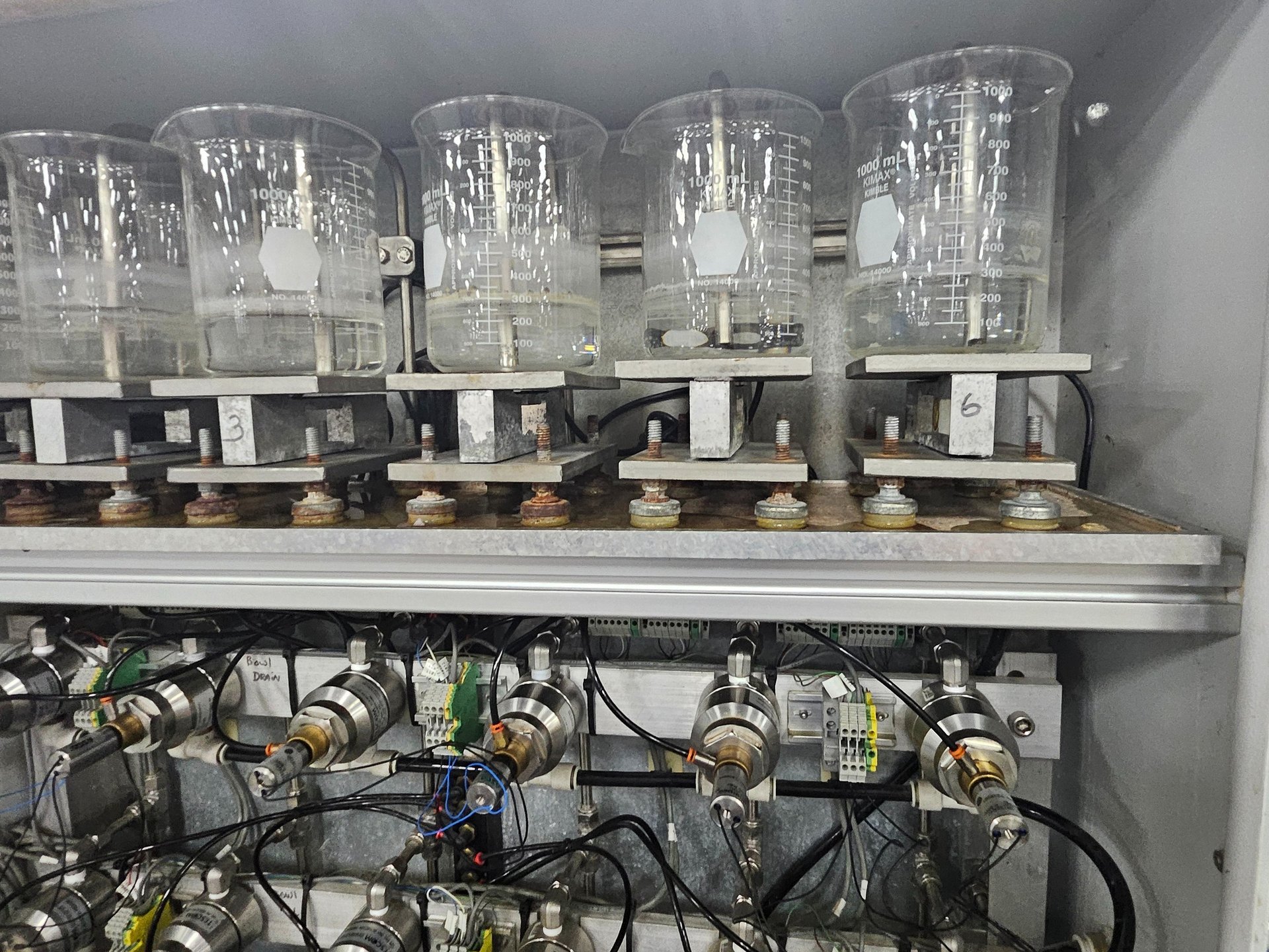 an abstract photo of a curved building with a blue sky in the background