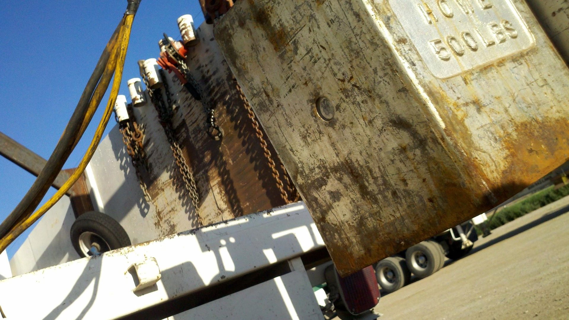 an abstract photo of a curved building with a blue sky in the background