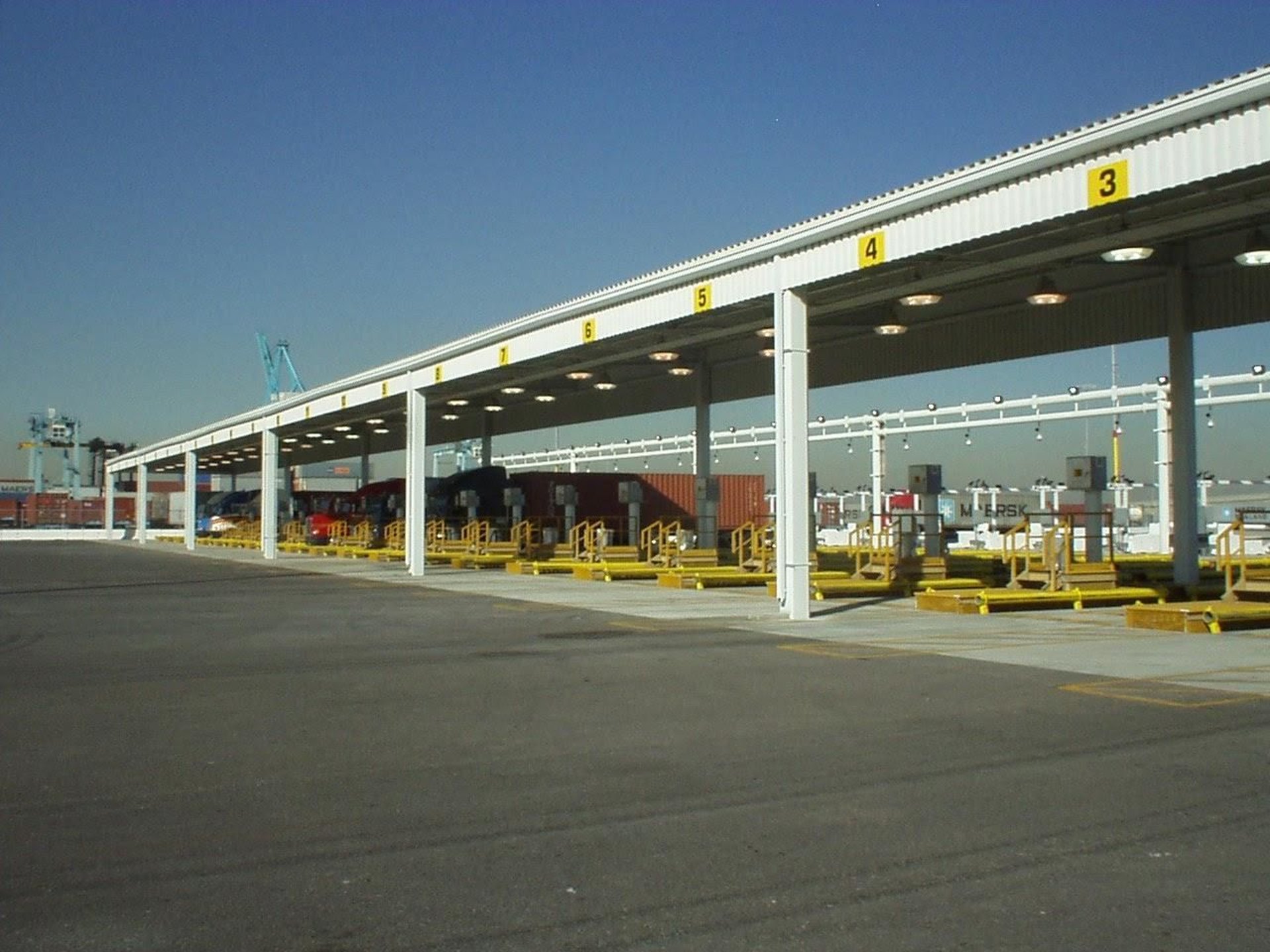 an abstract photo of a curved building with a blue sky in the background