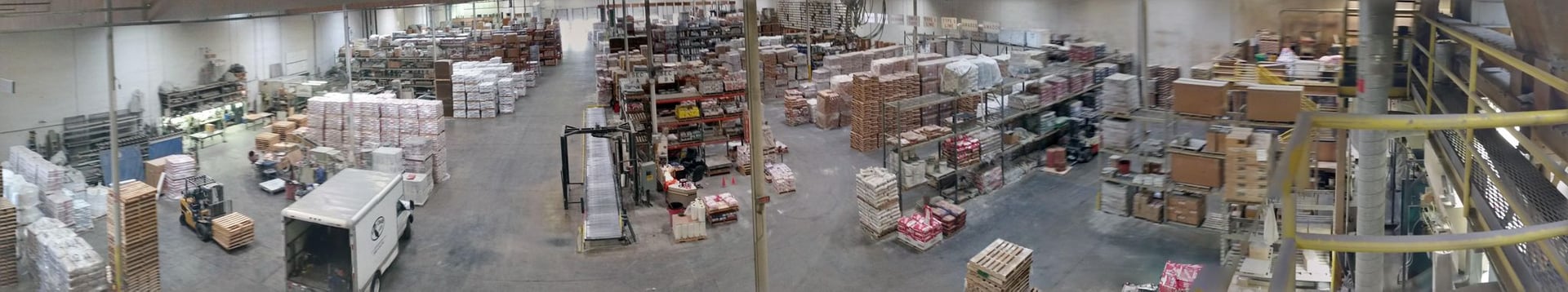 an abstract photo of a curved building with a blue sky in the background