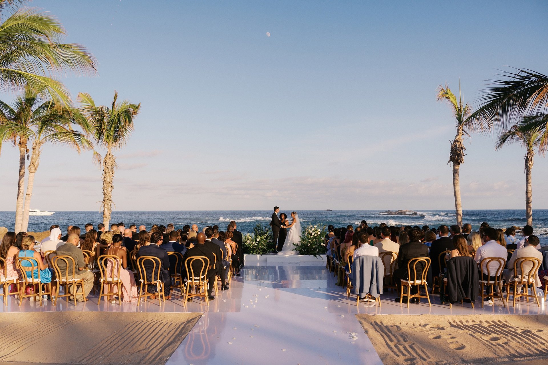 an abstract photo of a curved building with a blue sky in the background