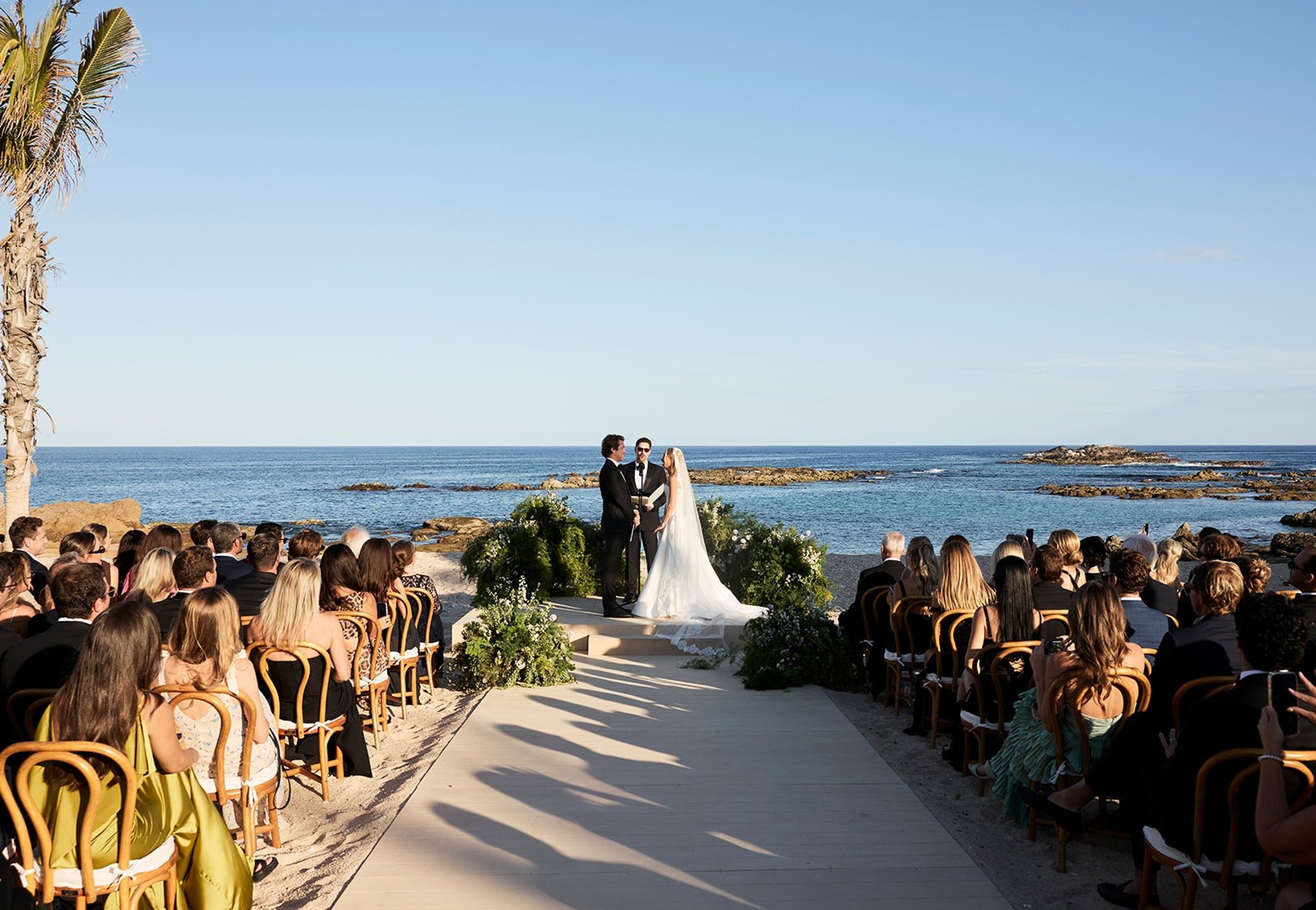 an abstract photo of a curved building with a blue sky in the background