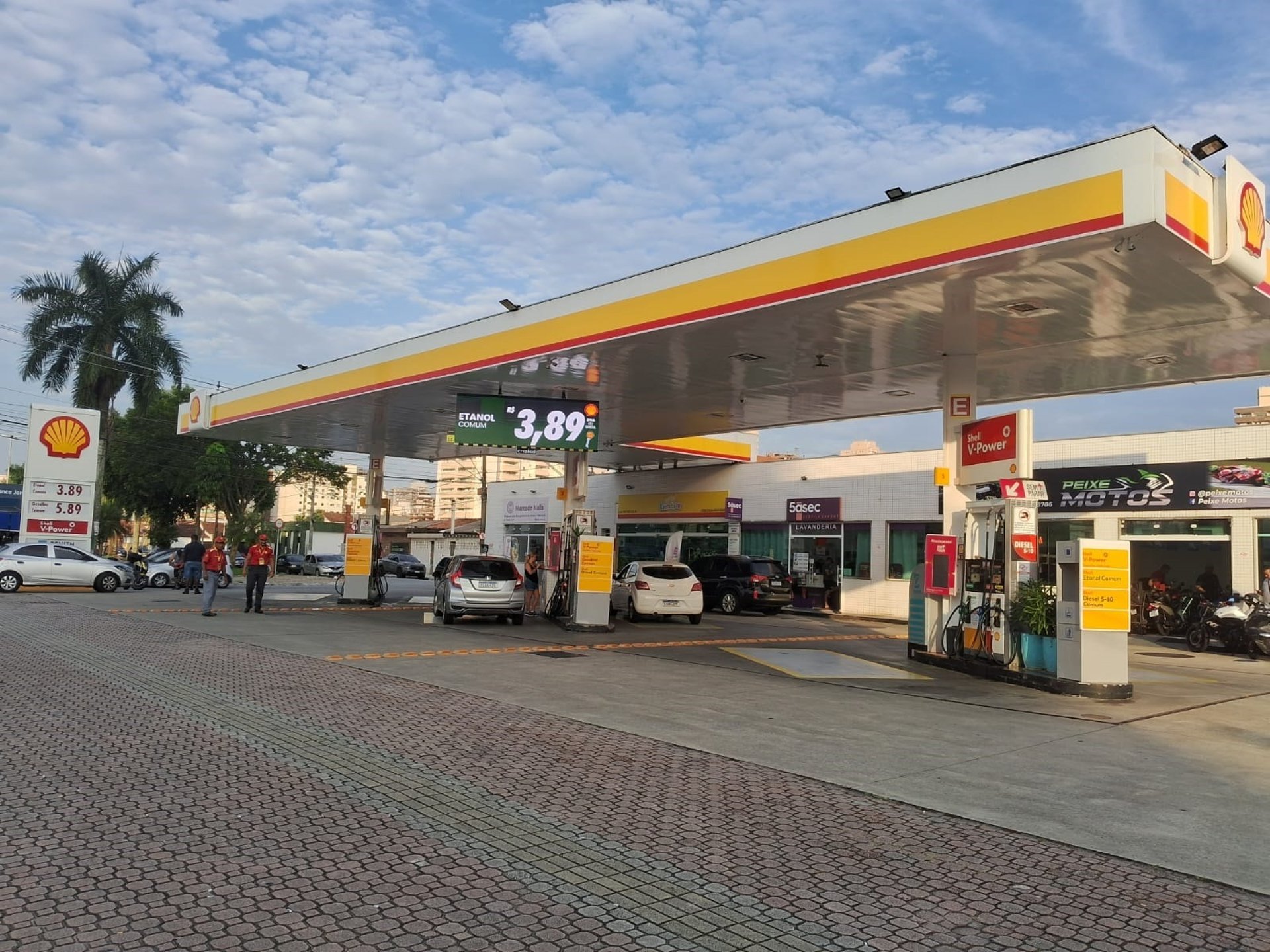 woman wearing yellow long-sleeved dress under white clouds and blue sky during daytime
