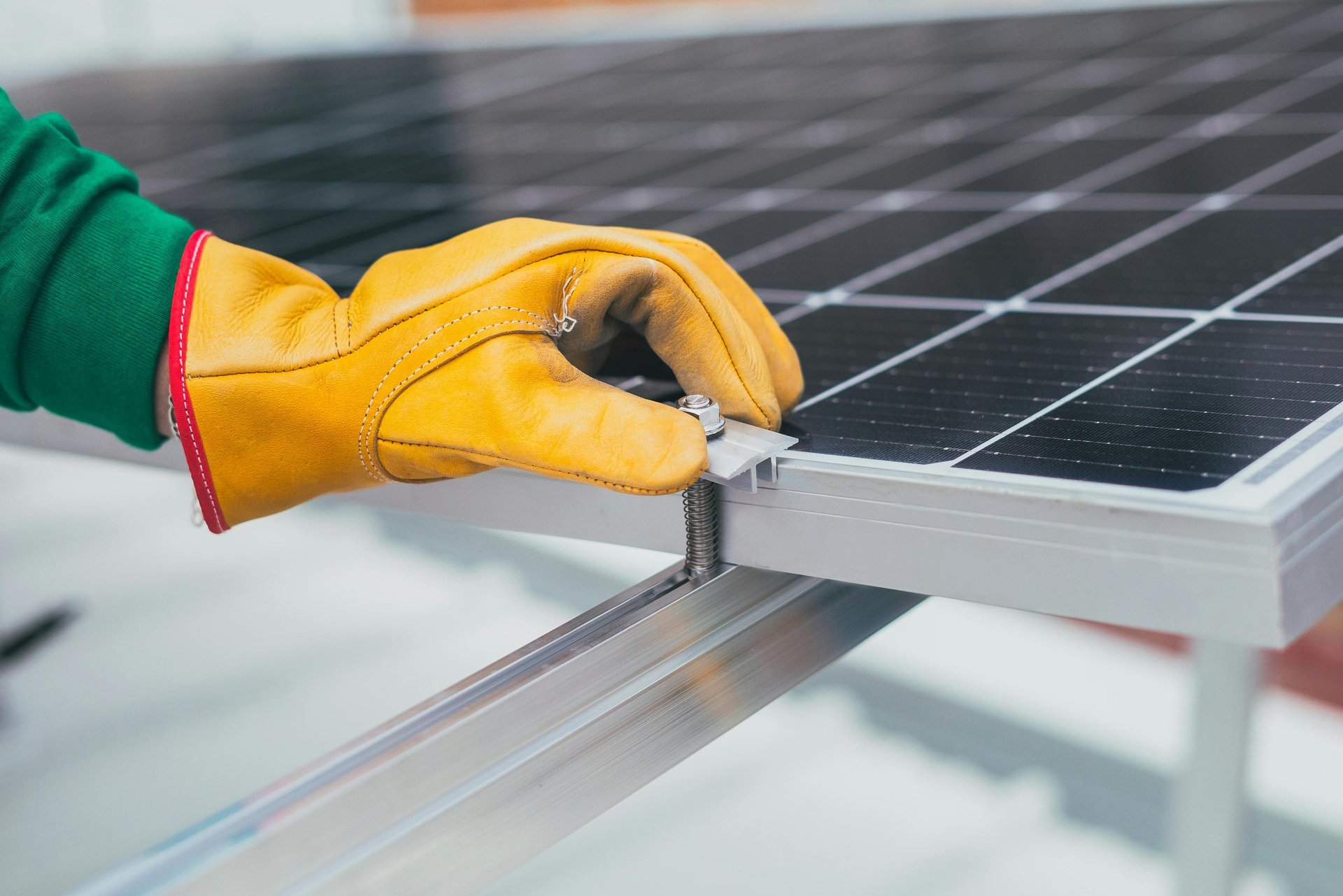 a white hard hat sitting on top of a solar panel