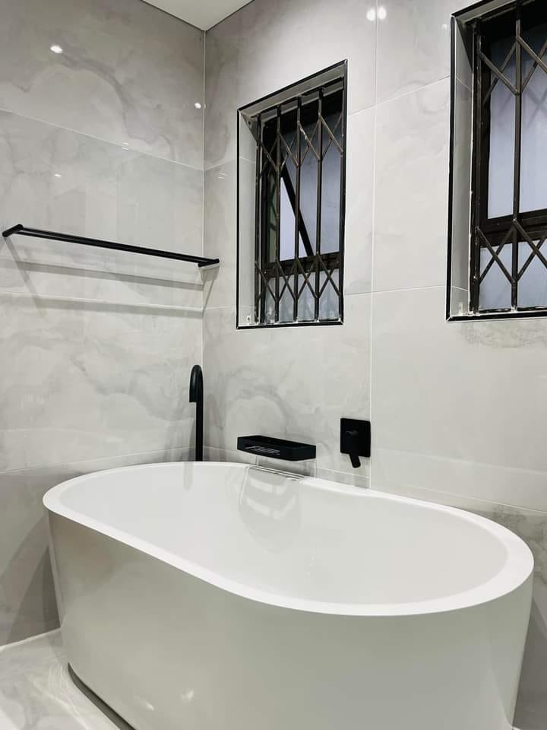 an abstract photo of a curved building with a blue sky in the background