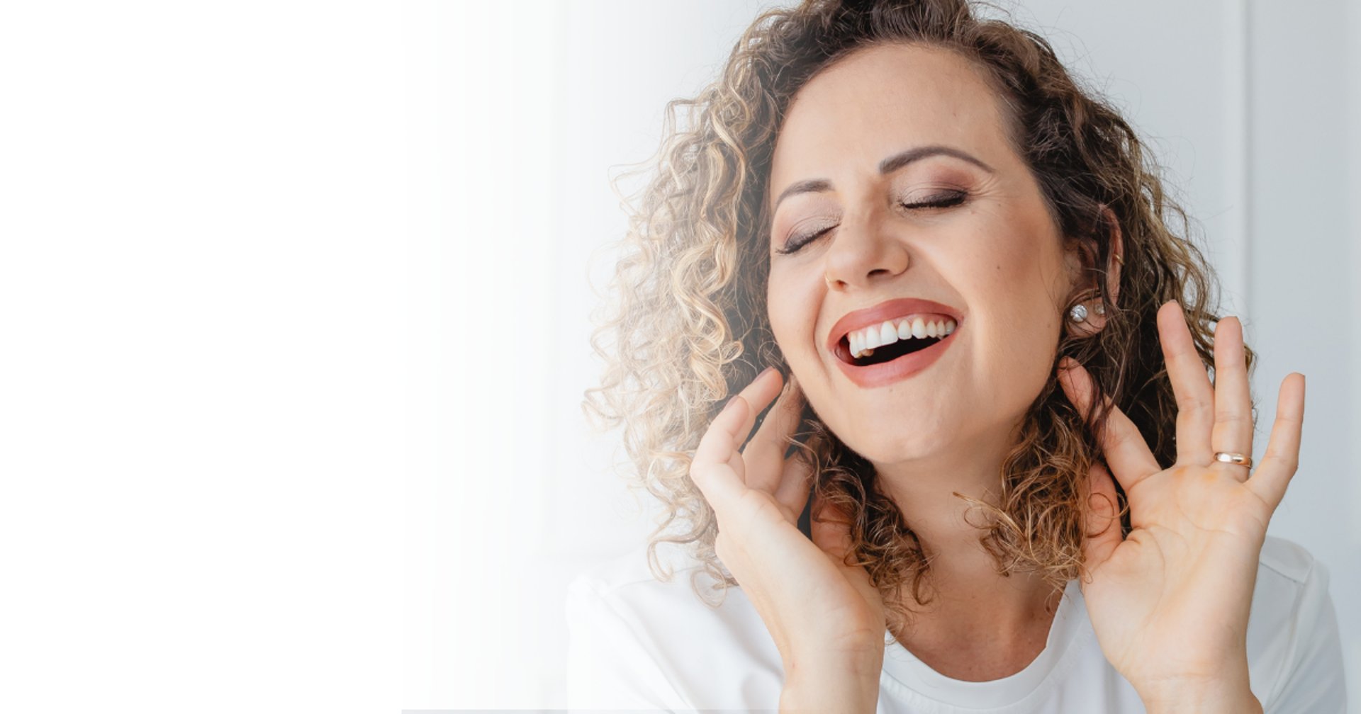 an abstract photo of a curved building with a blue sky in the background
