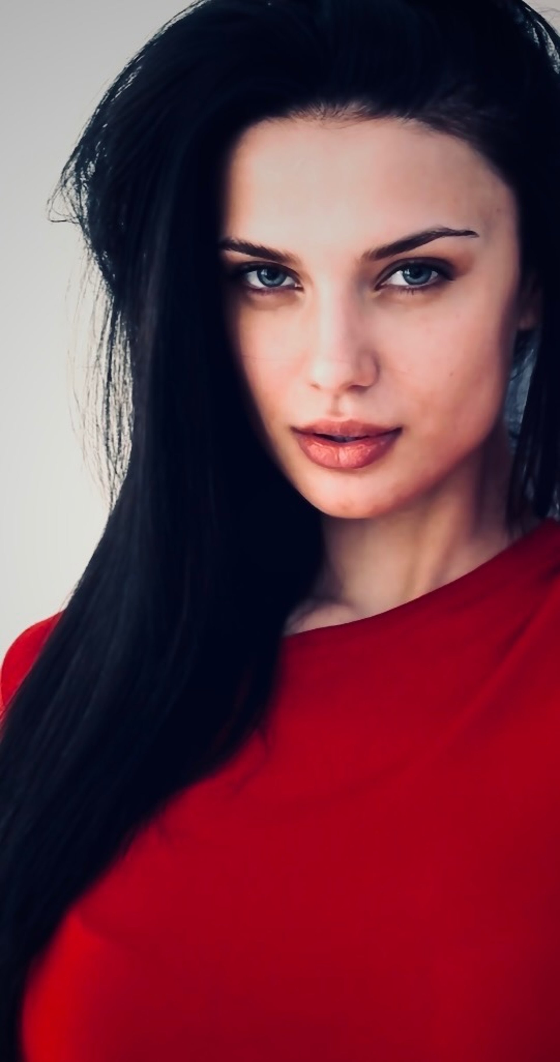 an abstract photo of a curved building with a blue sky in the background