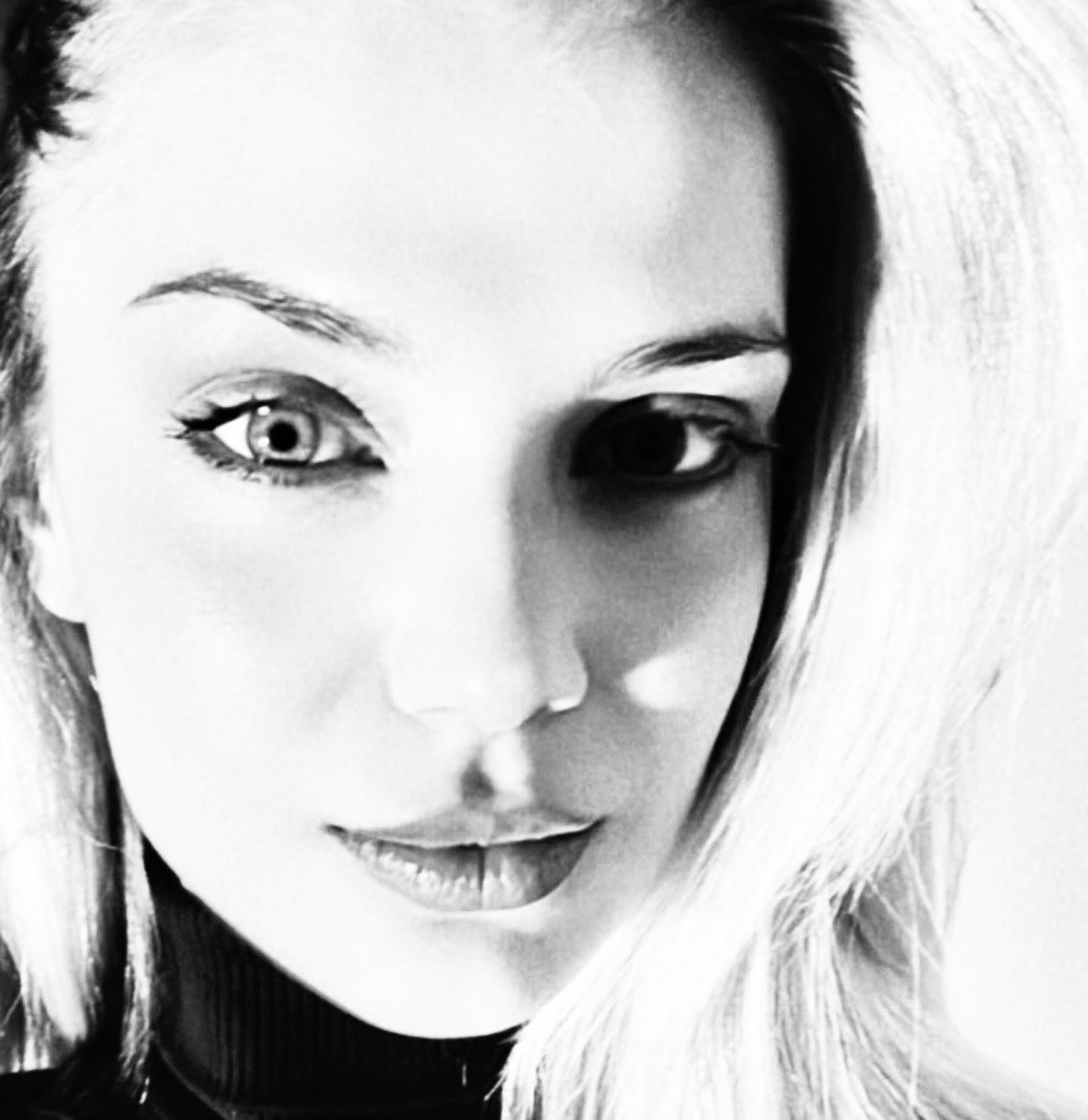 an abstract photo of a curved building with a blue sky in the background