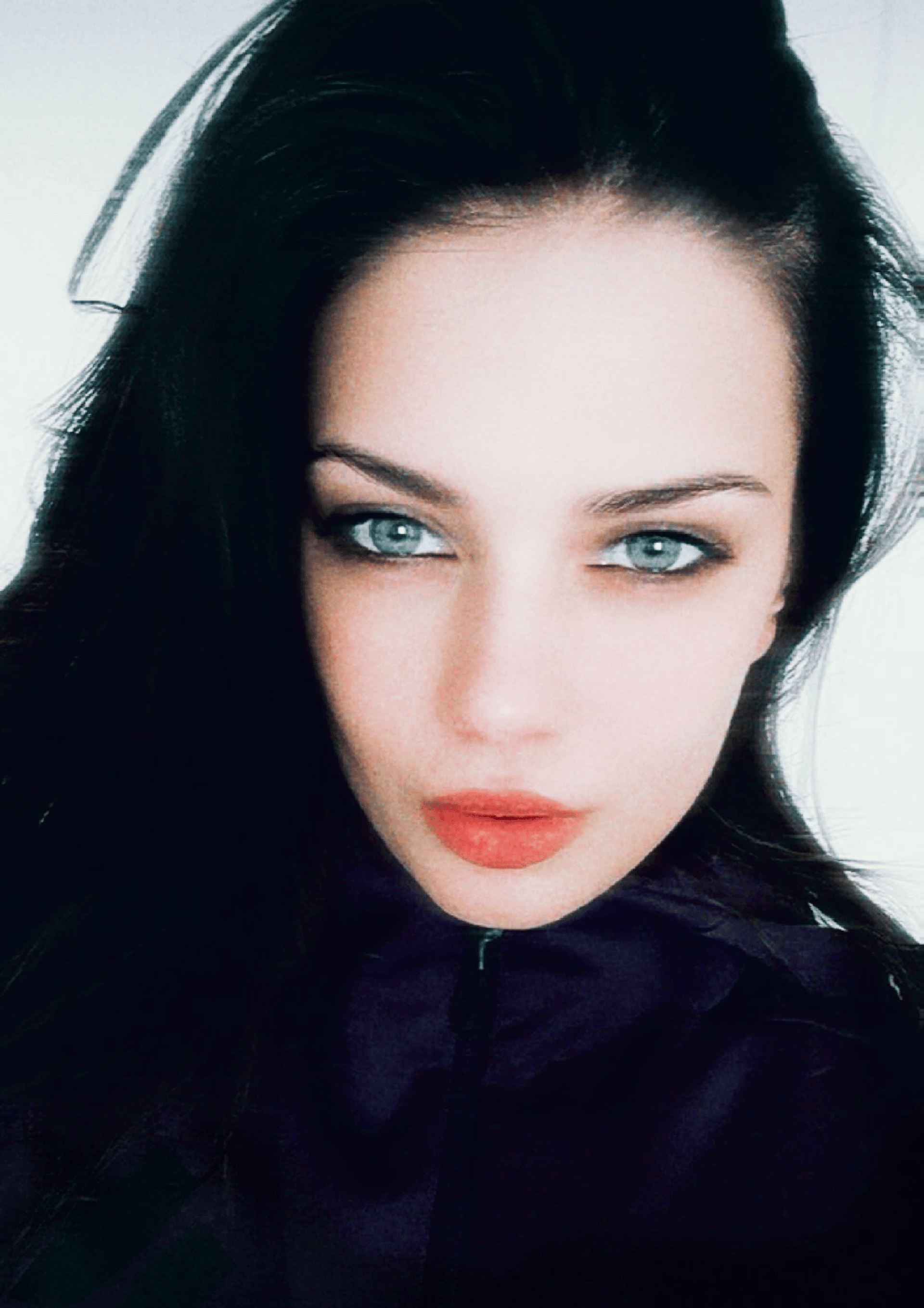 an abstract photo of a curved building with a blue sky in the background