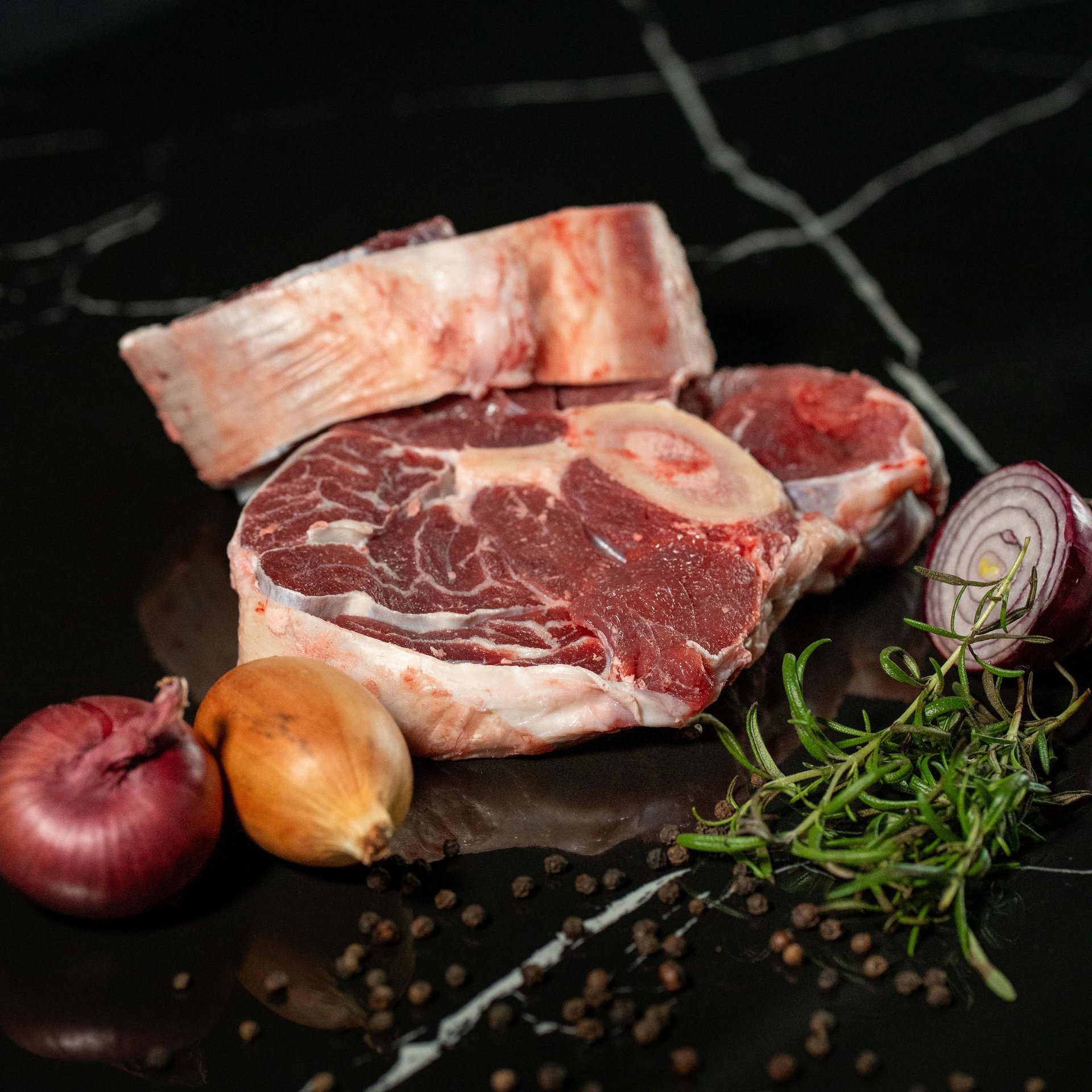 raw meat on brown wooden table
