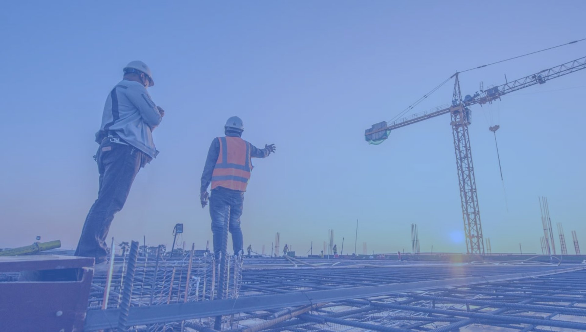 low angle photography of cranes on top of building