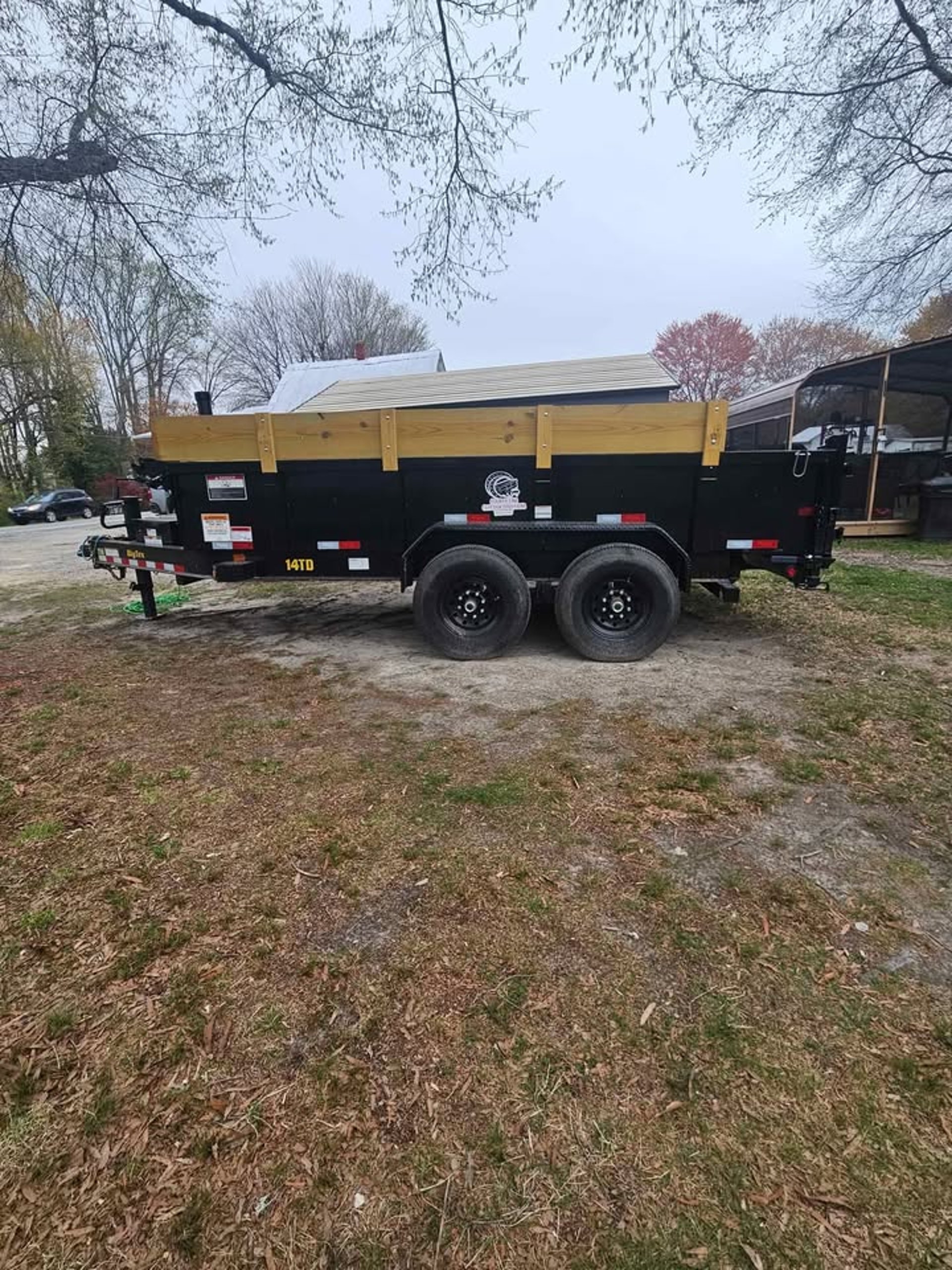 a man standing next to a pile of trash