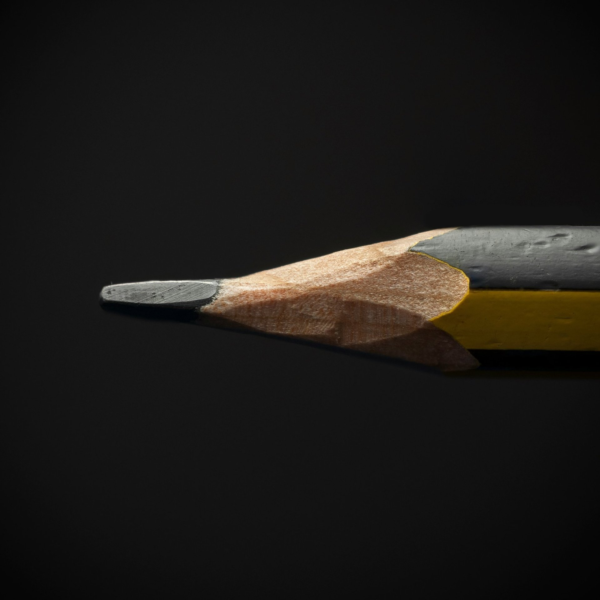 black pencil on black background