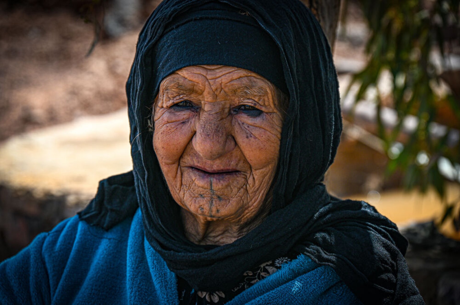 Berber woman Zahra cooking Moroccan food at Dar Toda guest house