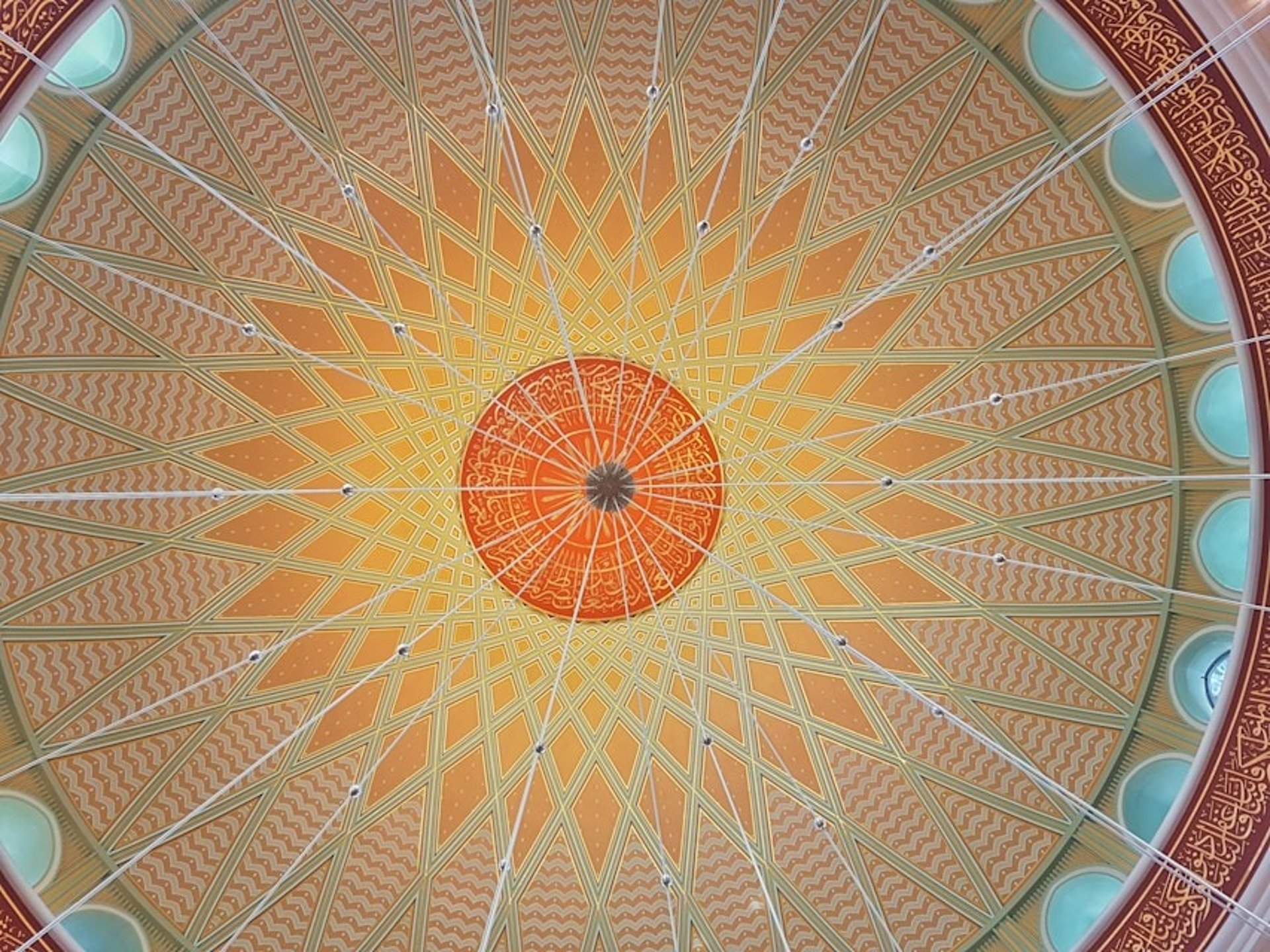 an abstract photo of a curved building with a blue sky in the background