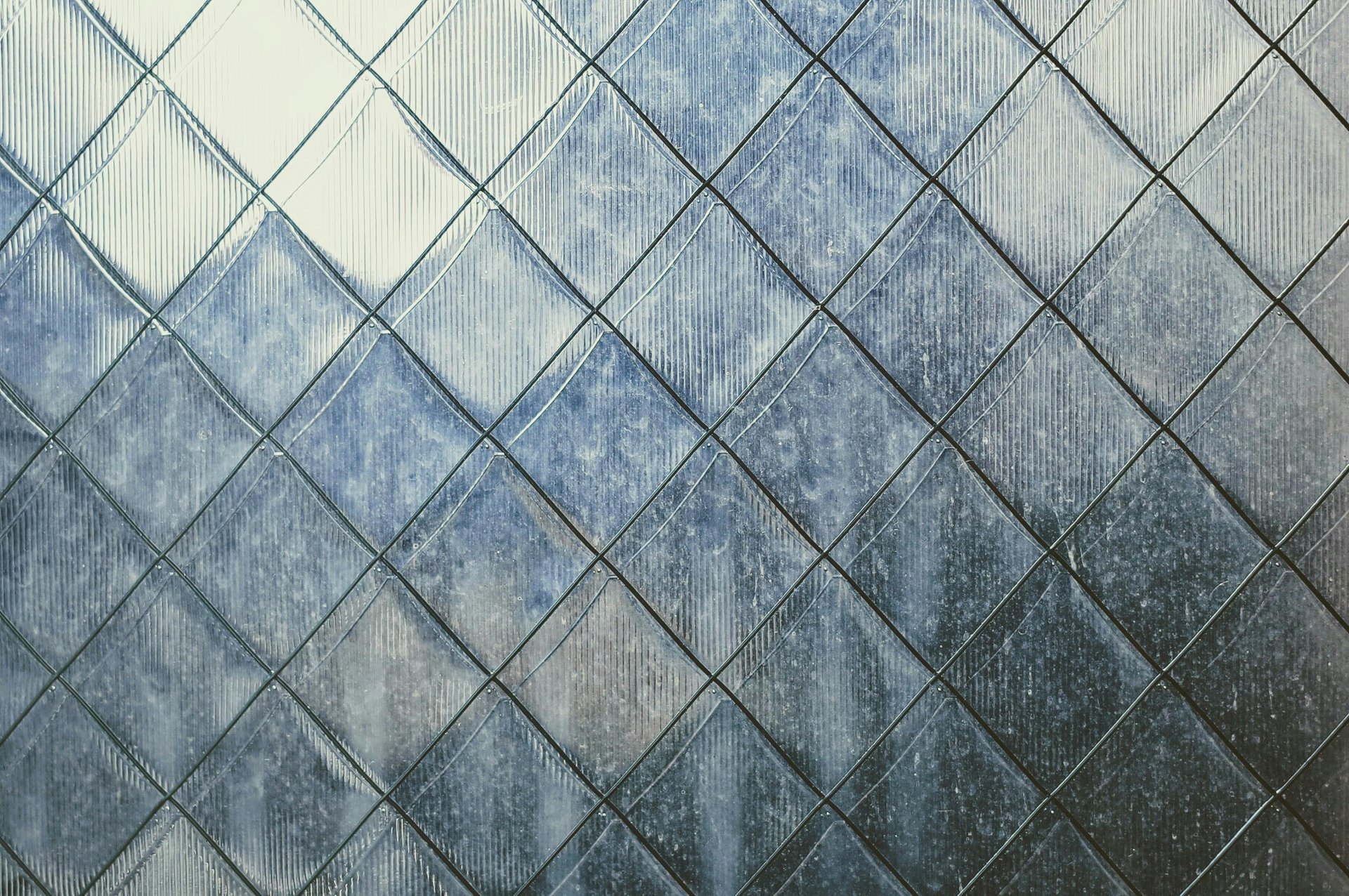 a black and white checkered board with a wooden frame