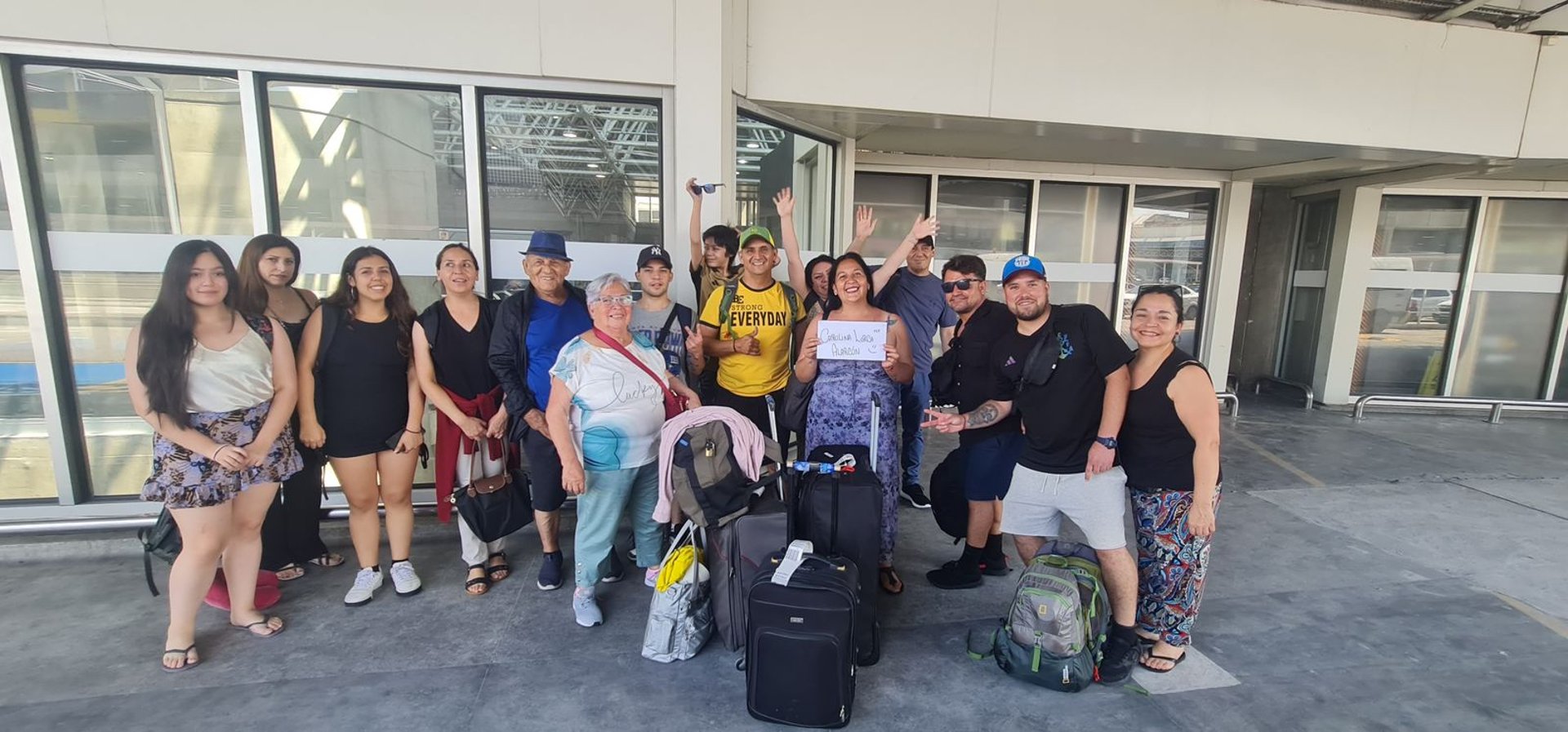 white airplane near trailers during sunset