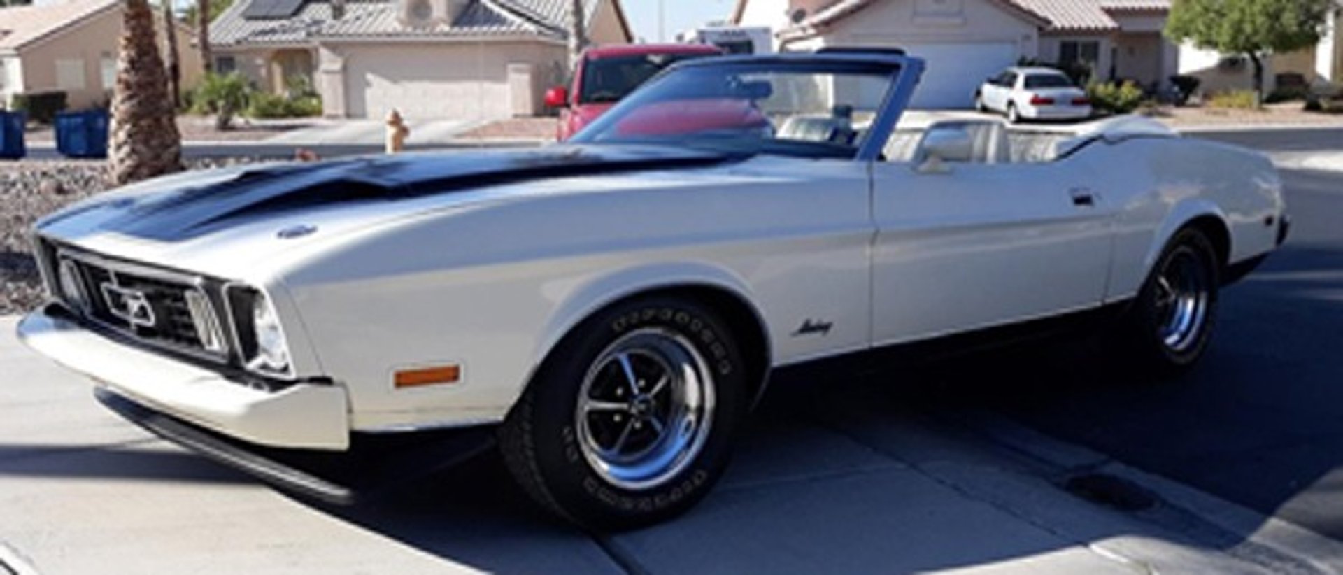 black Ford Mustang coupe on road