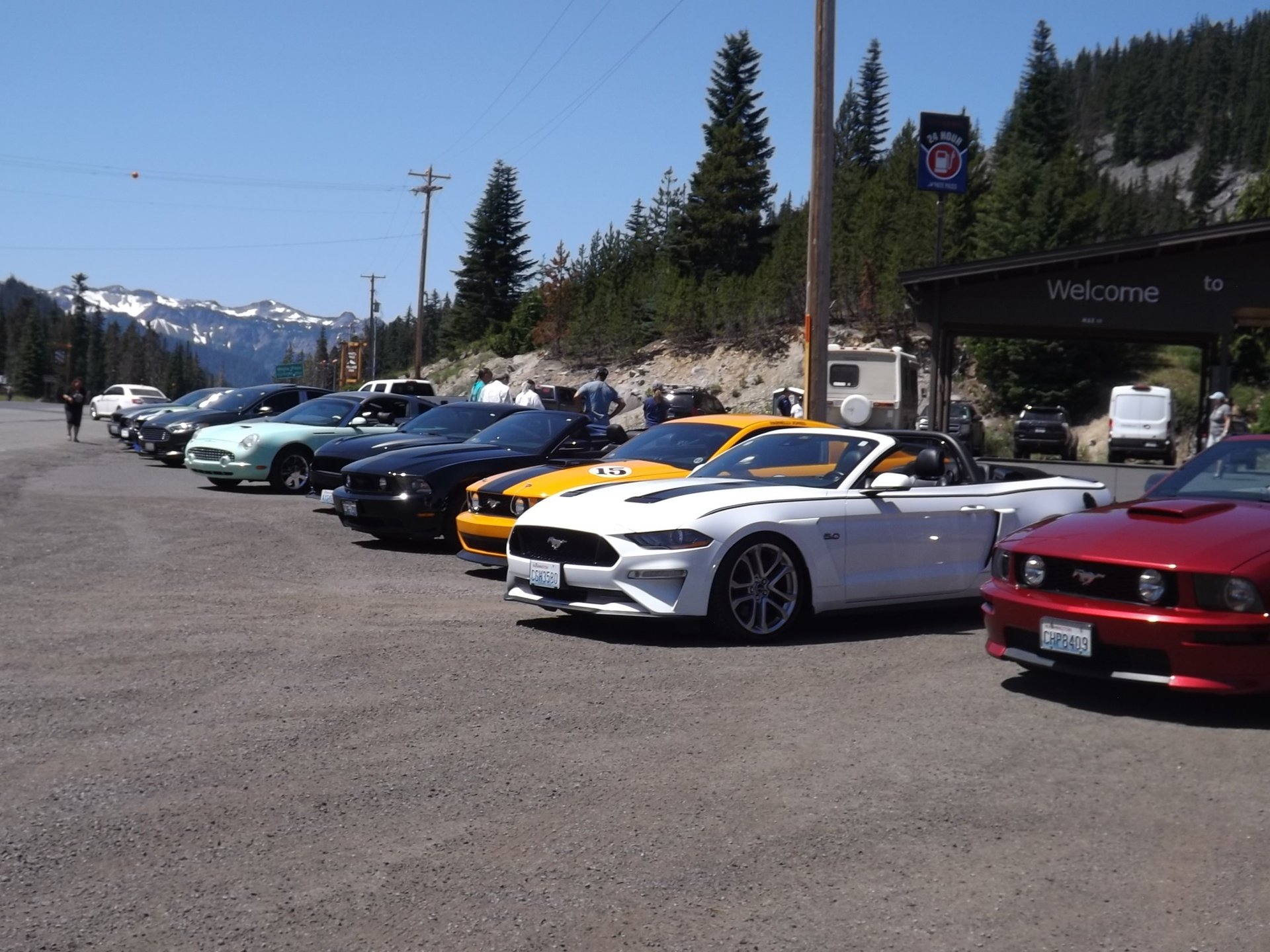 a red car parked in front of a brick building