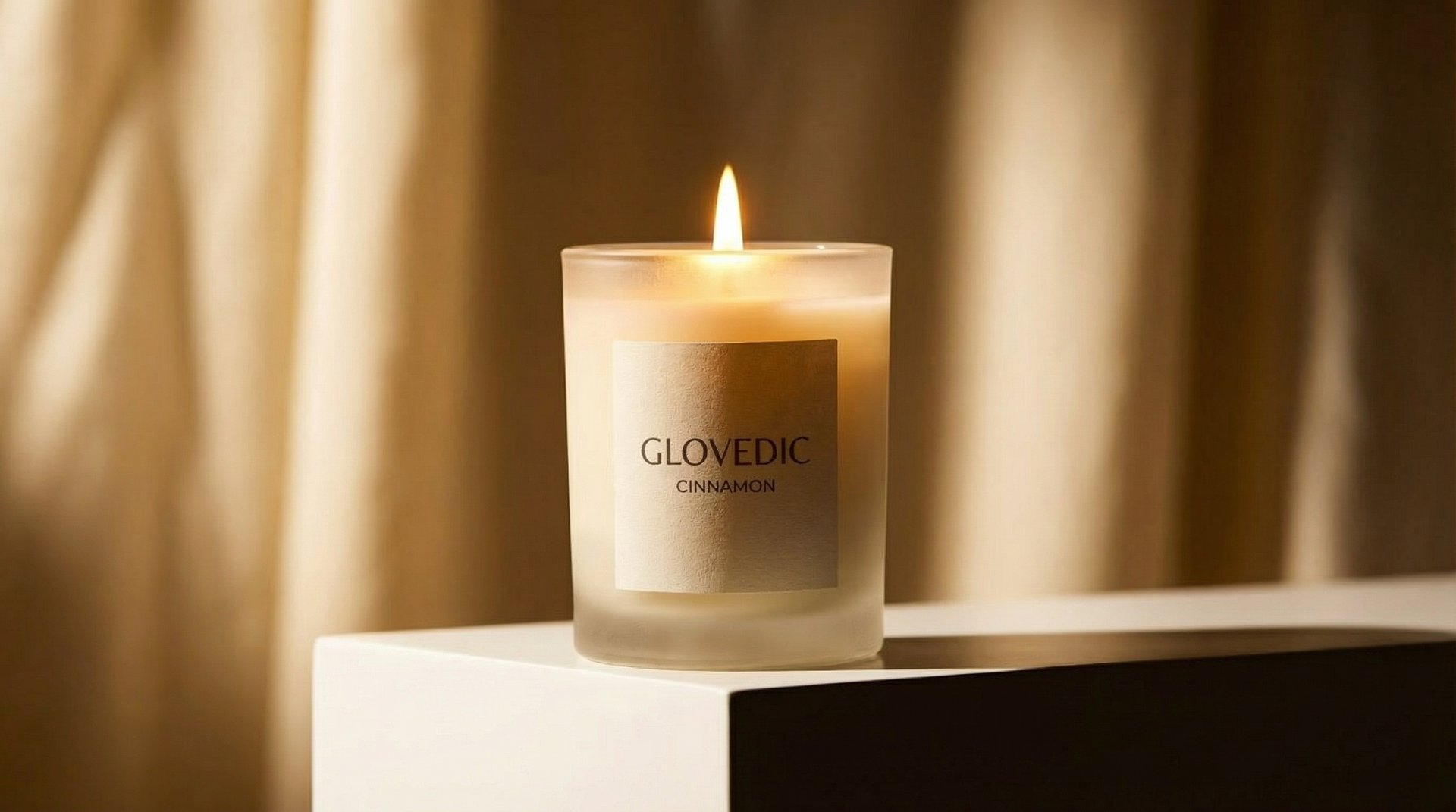Glovedic premium scented candles in minimal glass jars with soft natural lighting