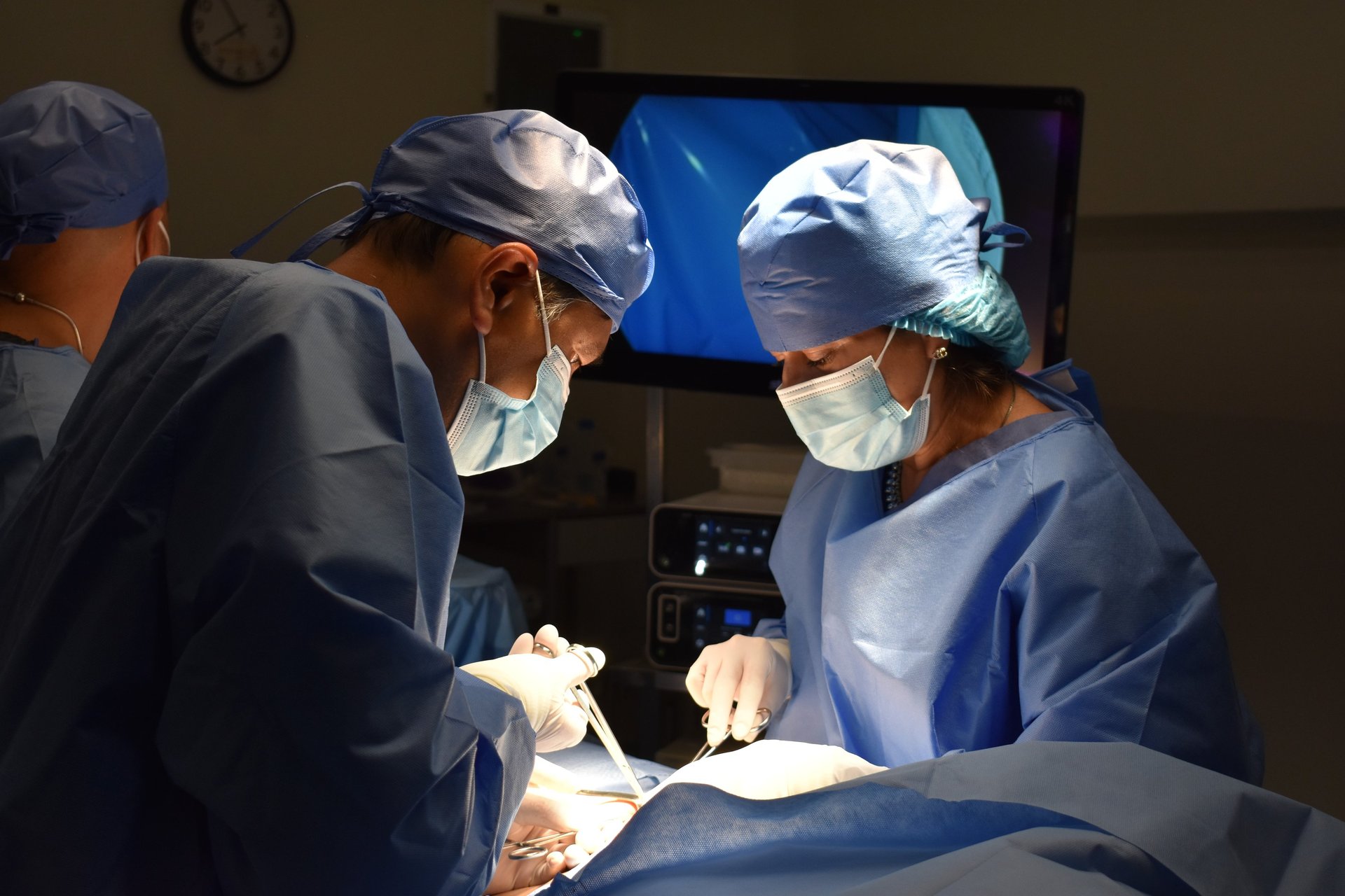 doctor performing operation