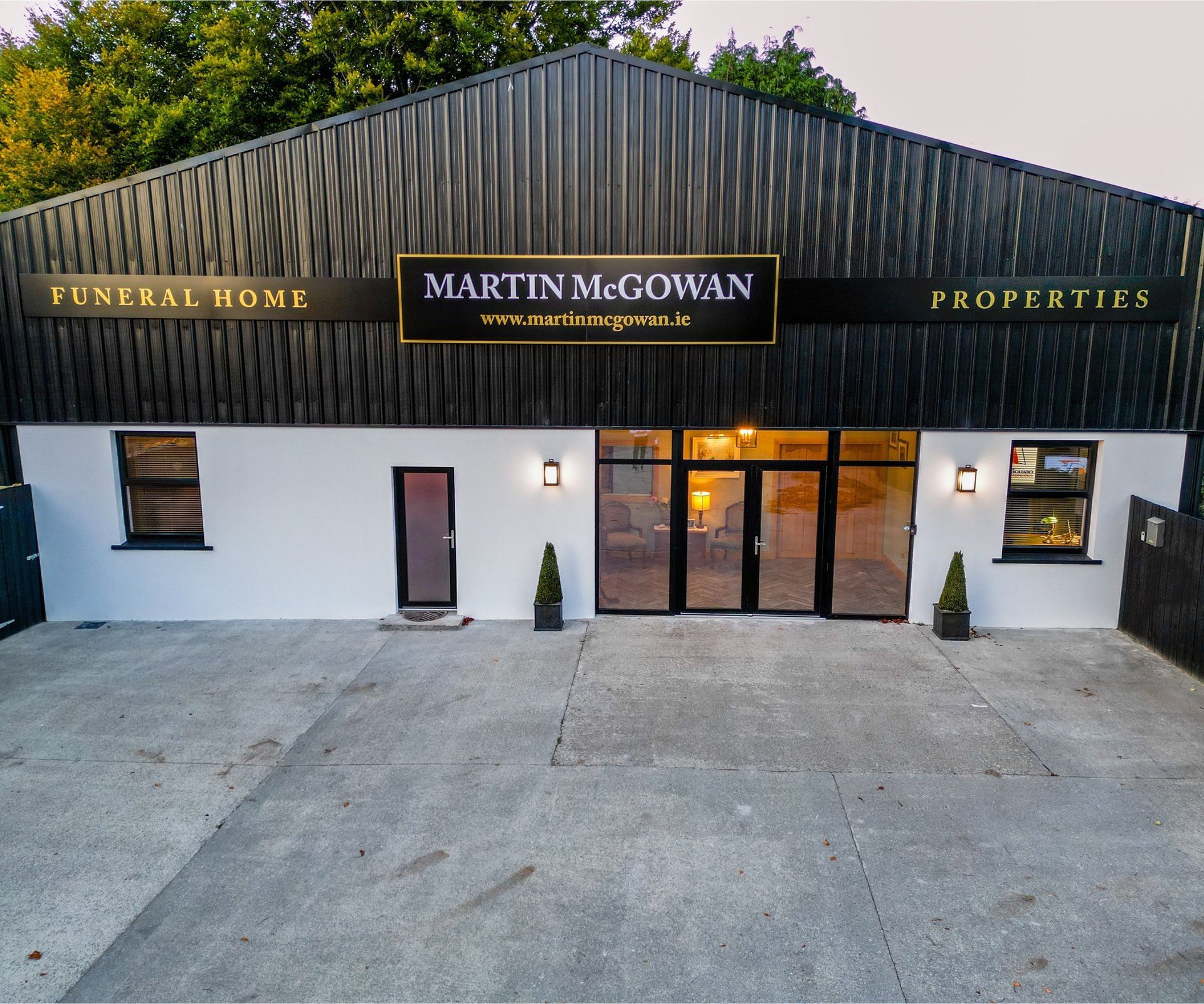 black and brown leather padded tub sofa