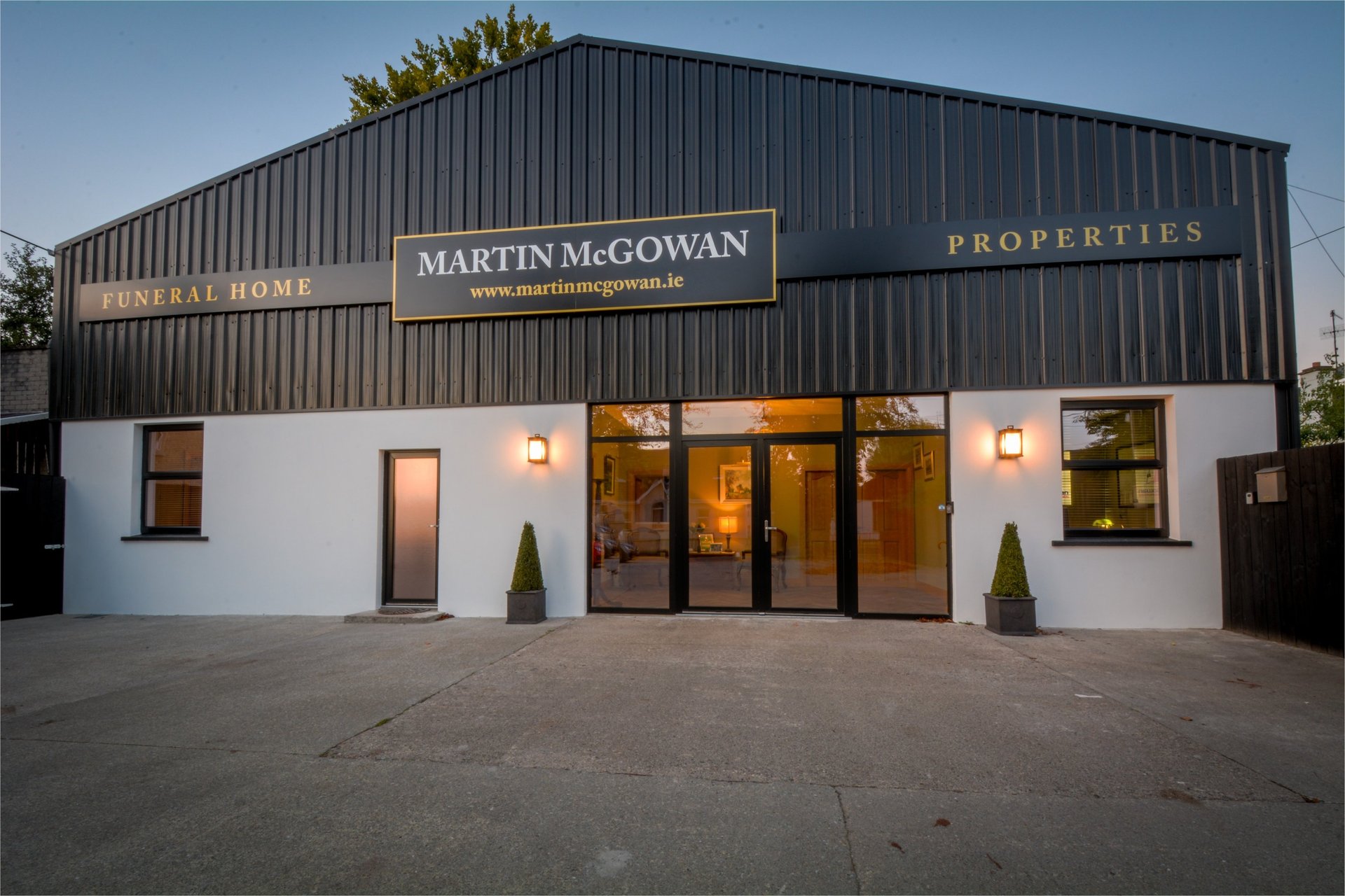 black and brown leather padded tub sofa