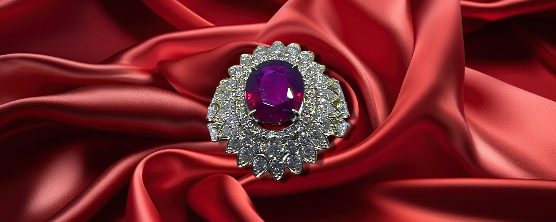 a close up of some red crystals on a white surface