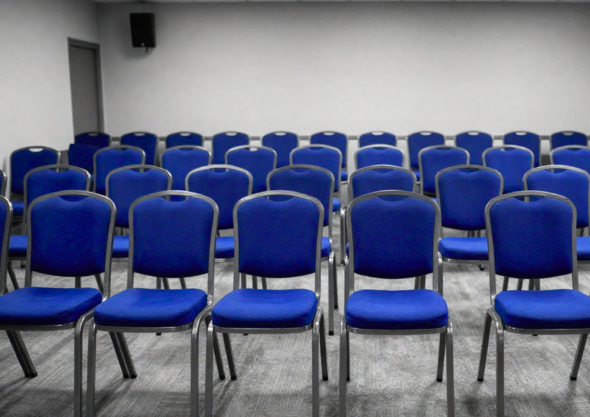 an abstract photo of a curved building with a blue sky in the background