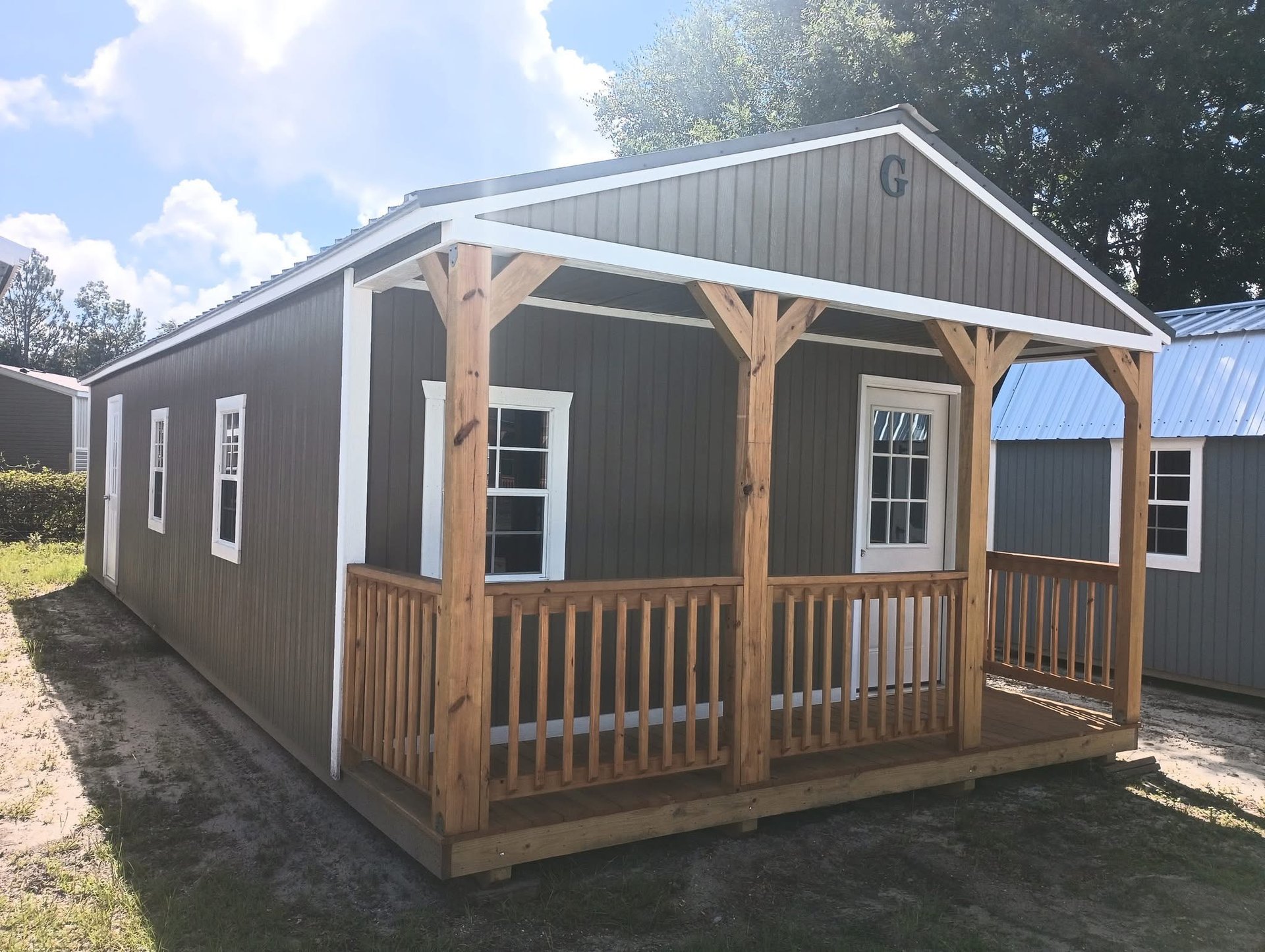 woman wearing yellow long-sleeved dress under white clouds and blue sky during daytime