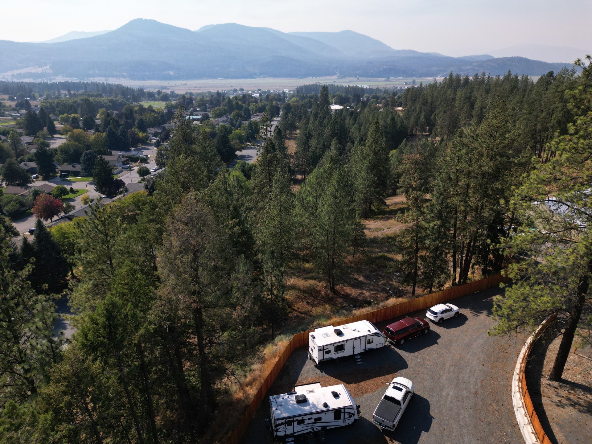 people standing near white rv trailer during daytime