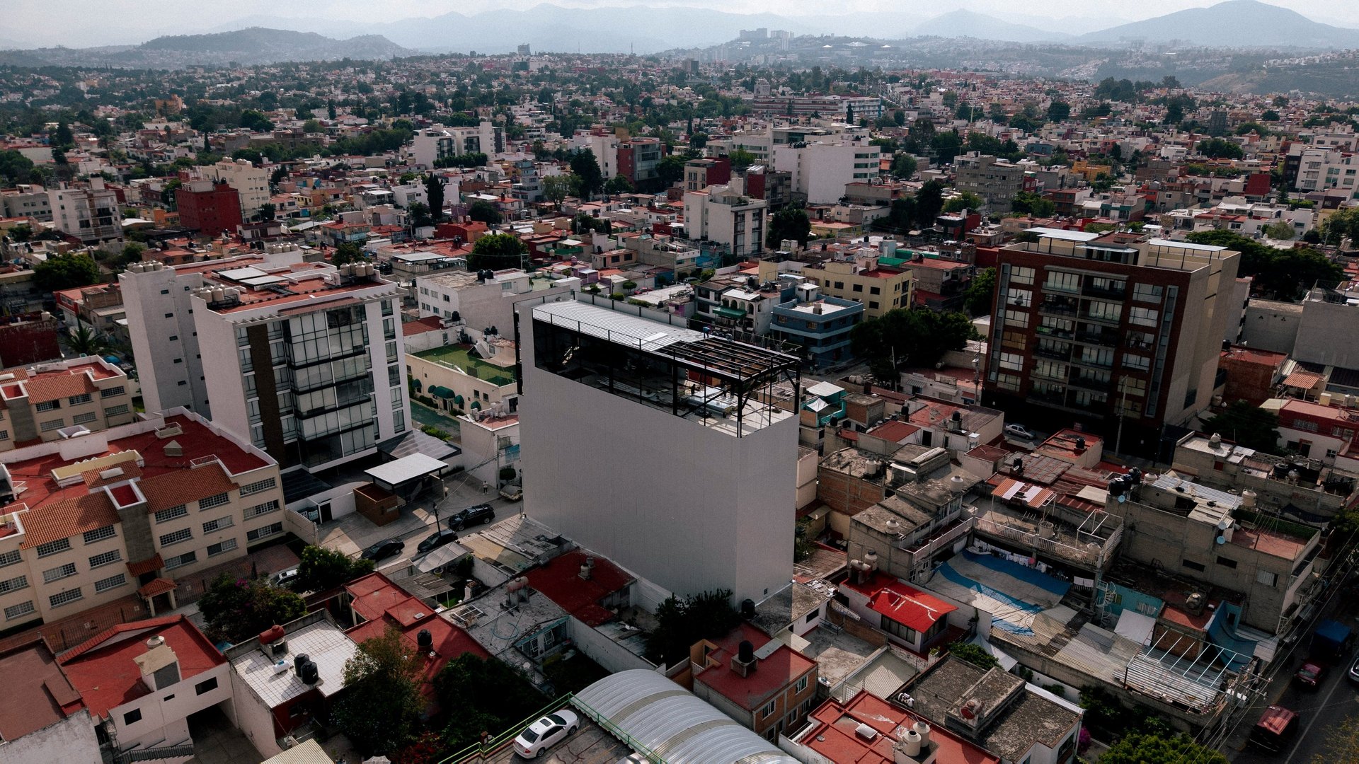 black and brown leather padded tub sofa