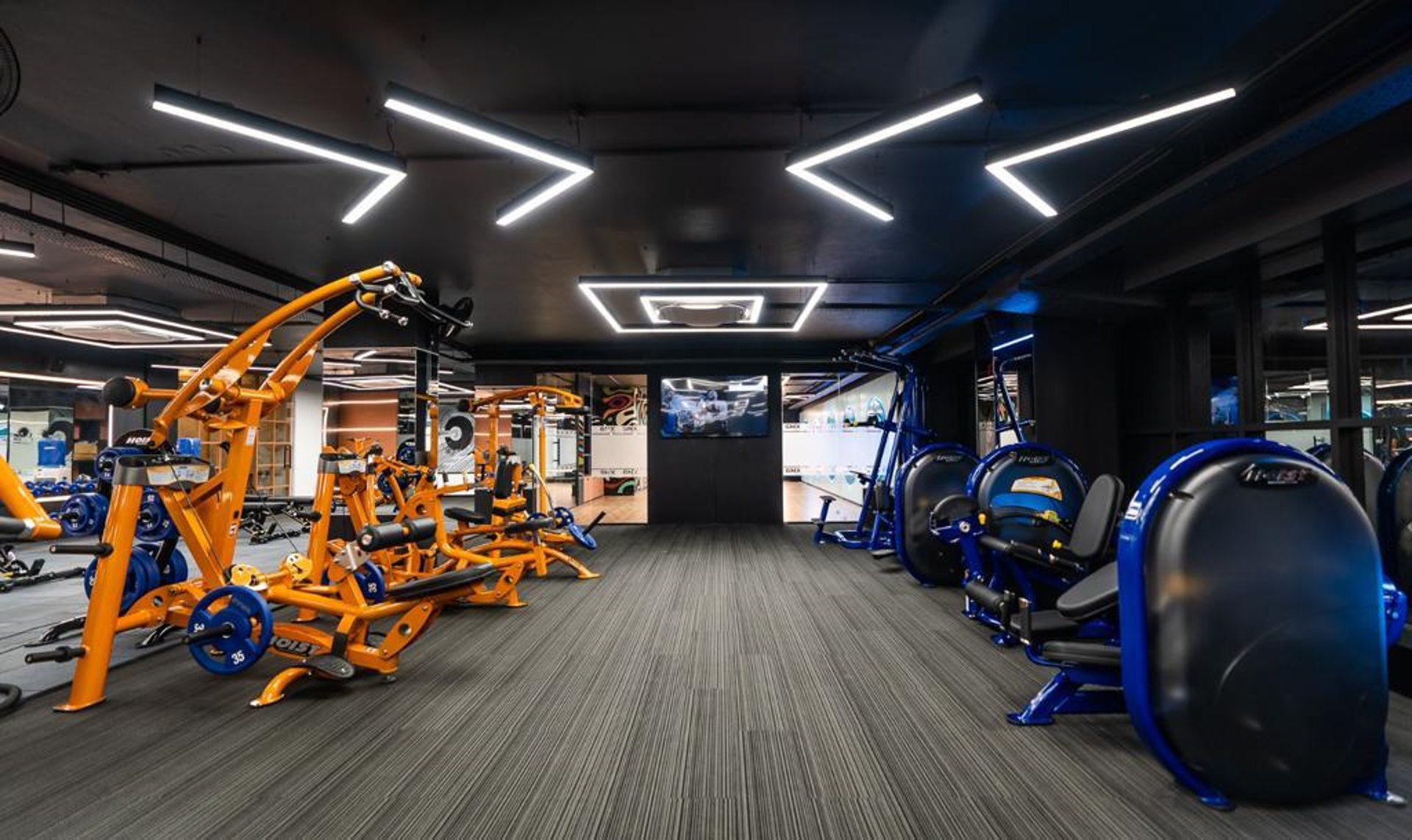 an abstract photo of a curved building with a blue sky in the background