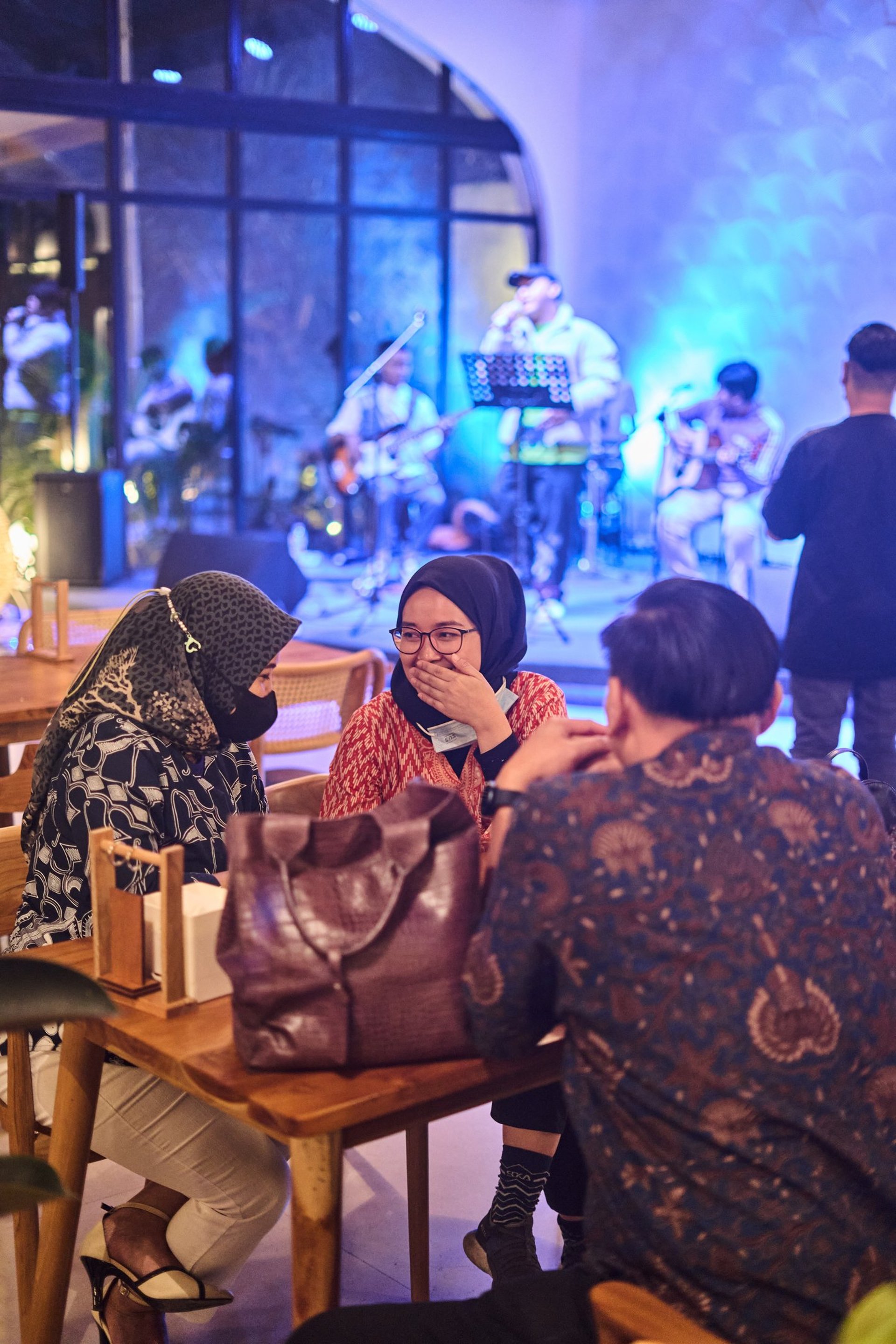an abstract photo of a curved building with a blue sky in the background