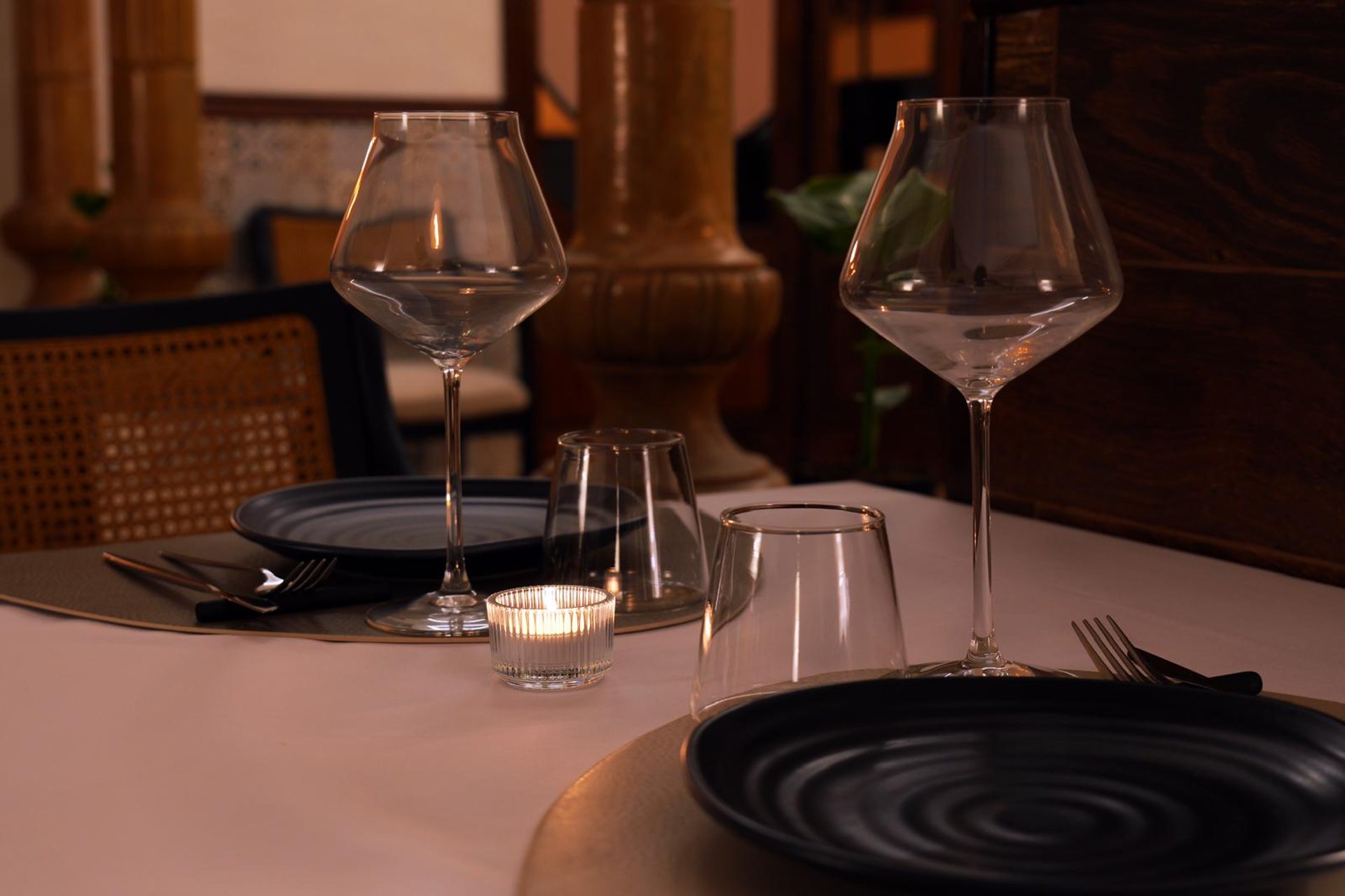 an abstract photo of a curved building with a blue sky in the background