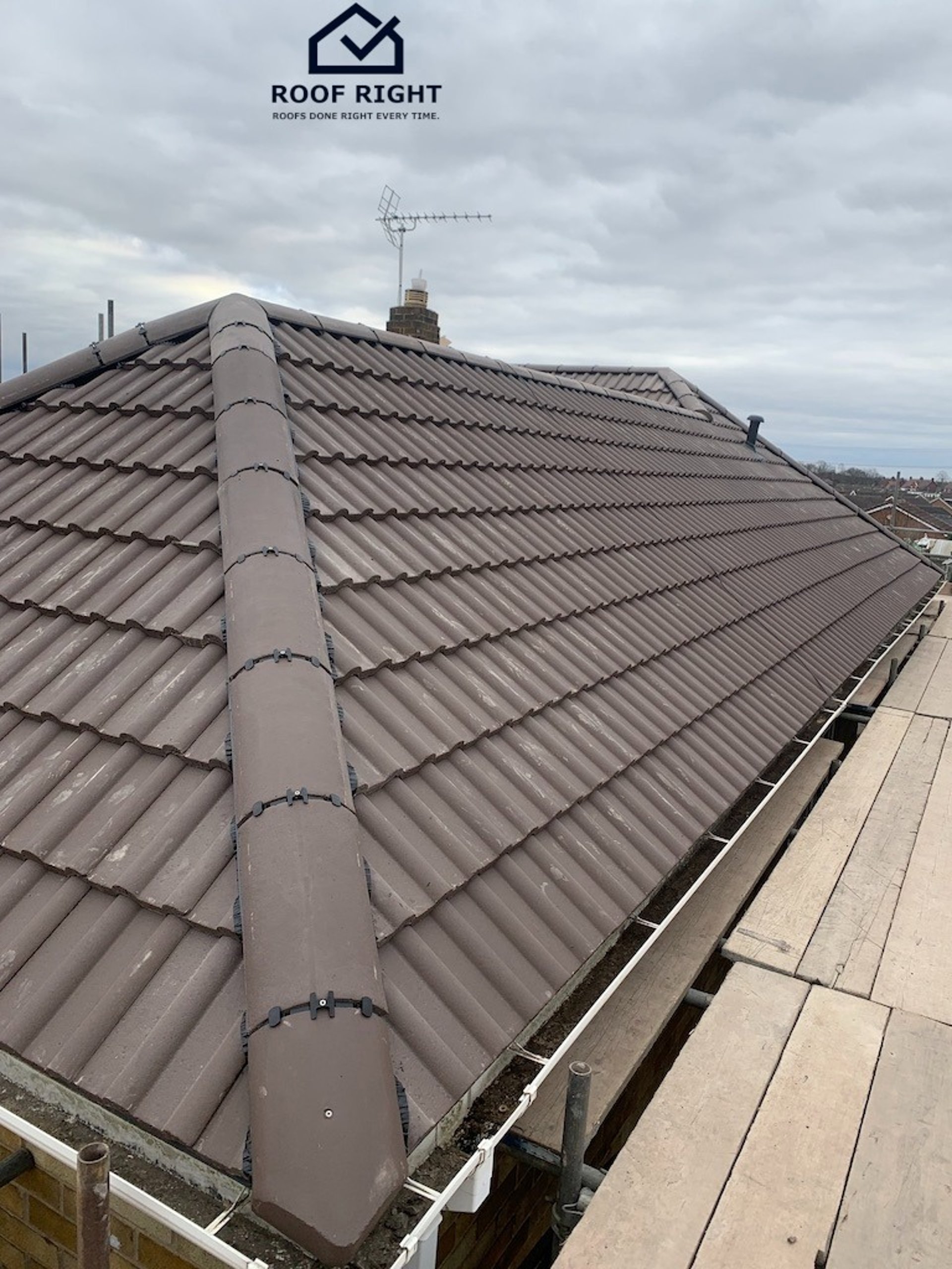 black and brown leather padded tub sofa