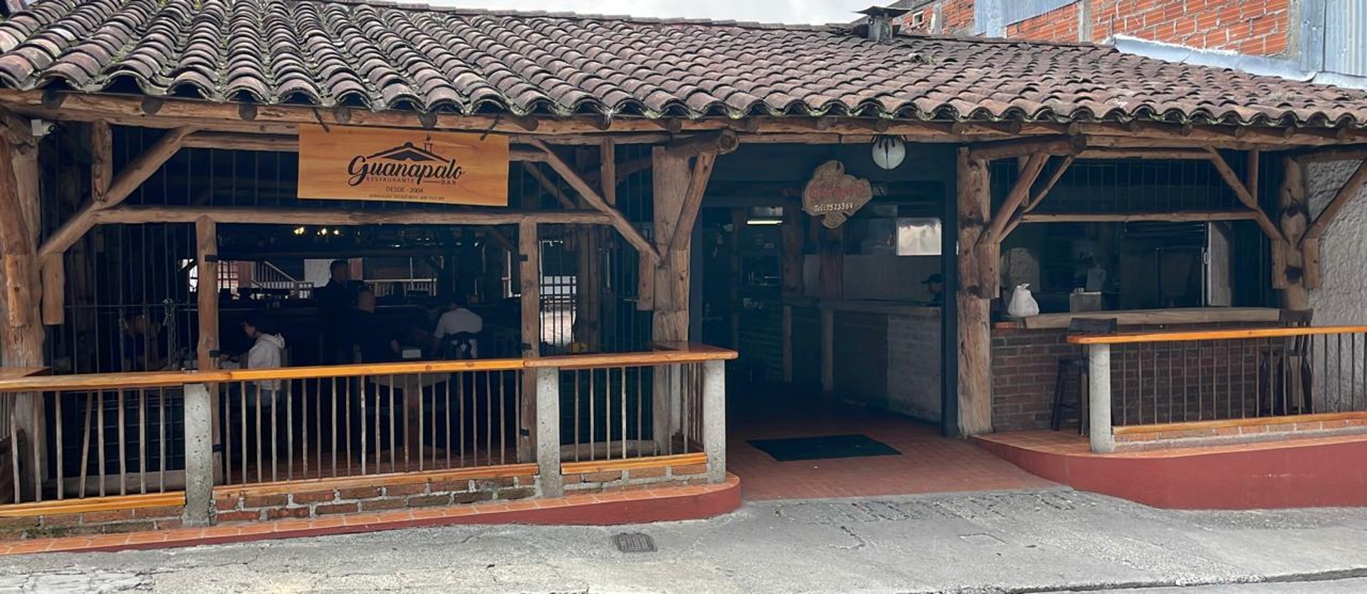 black and brown leather padded tub sofa
