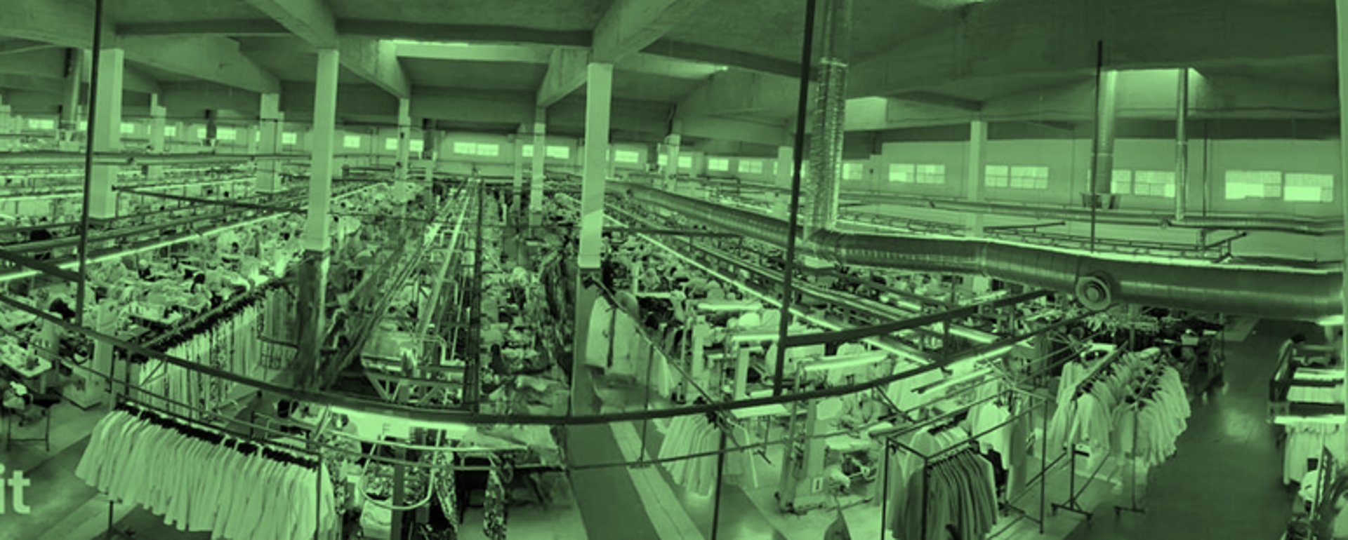 an abstract photo of a curved building with a blue sky in the background