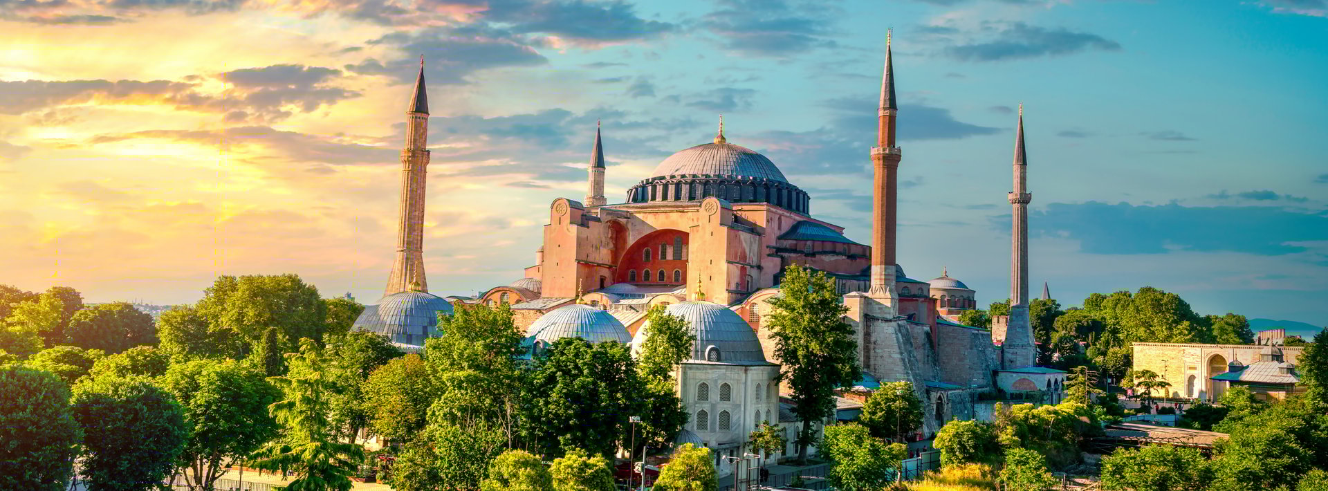 an abstract photo of a curved building with a blue sky in the background