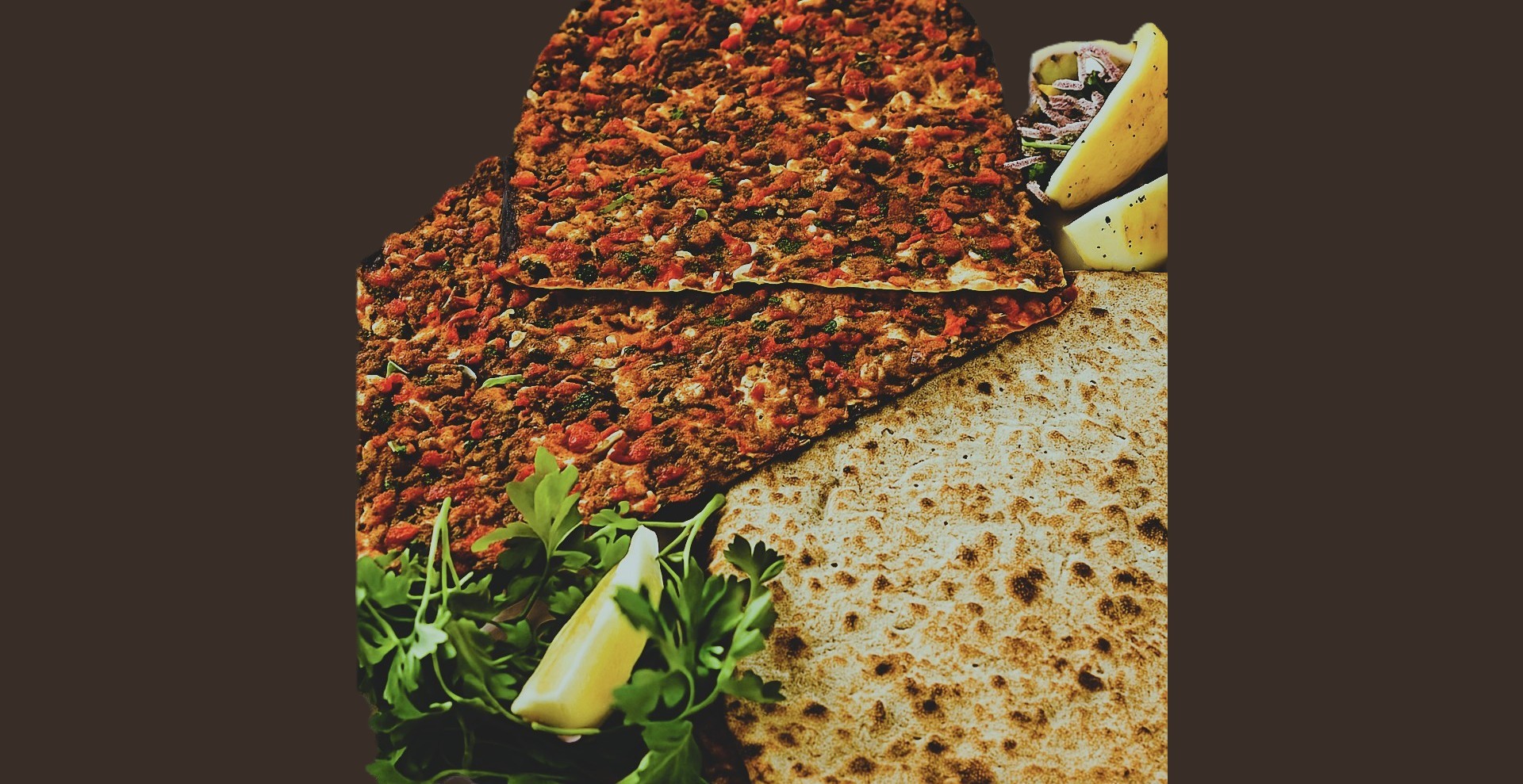 sliced pizza on brown wooden round plate