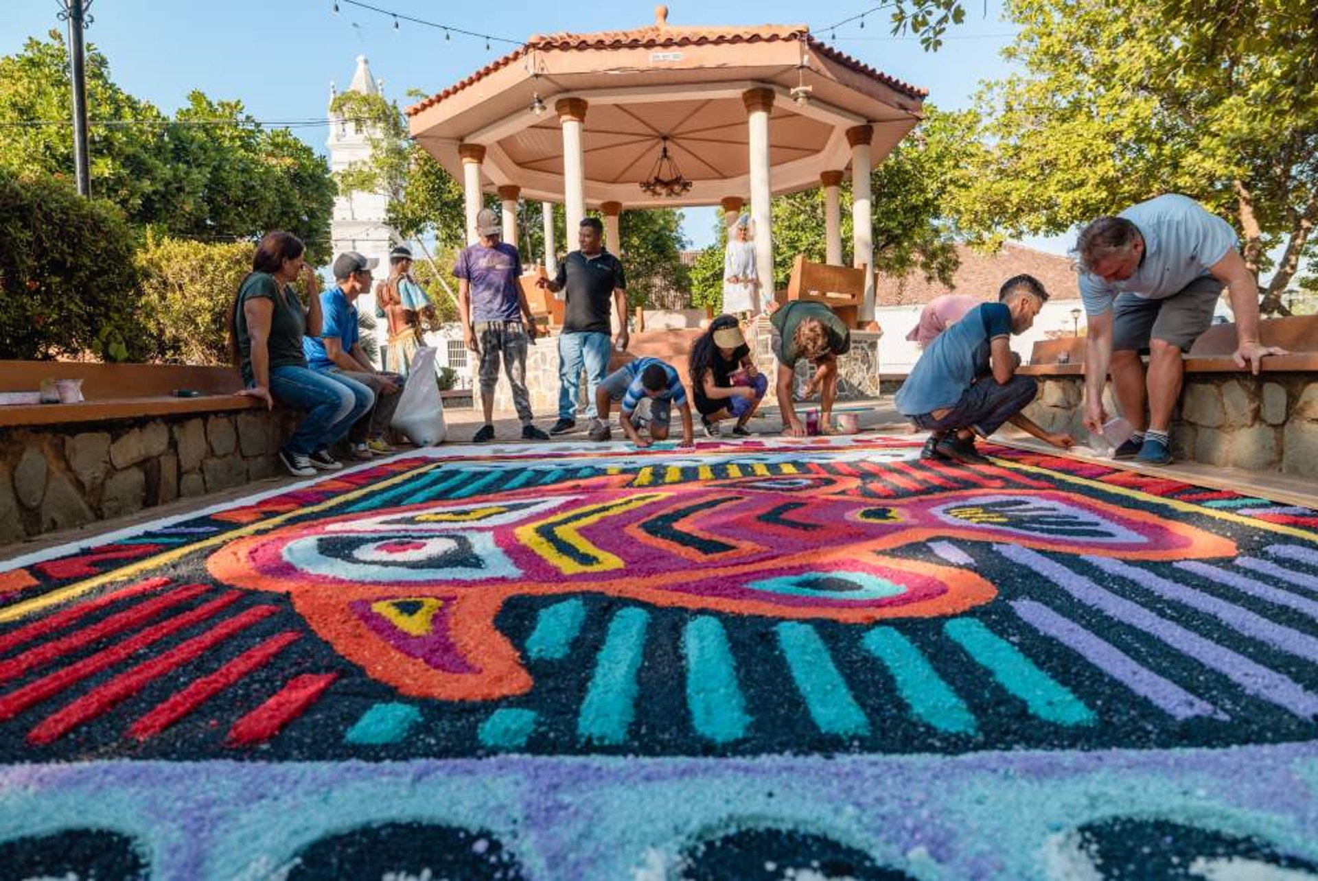 an abstract photo of a curved building with a blue sky in the background