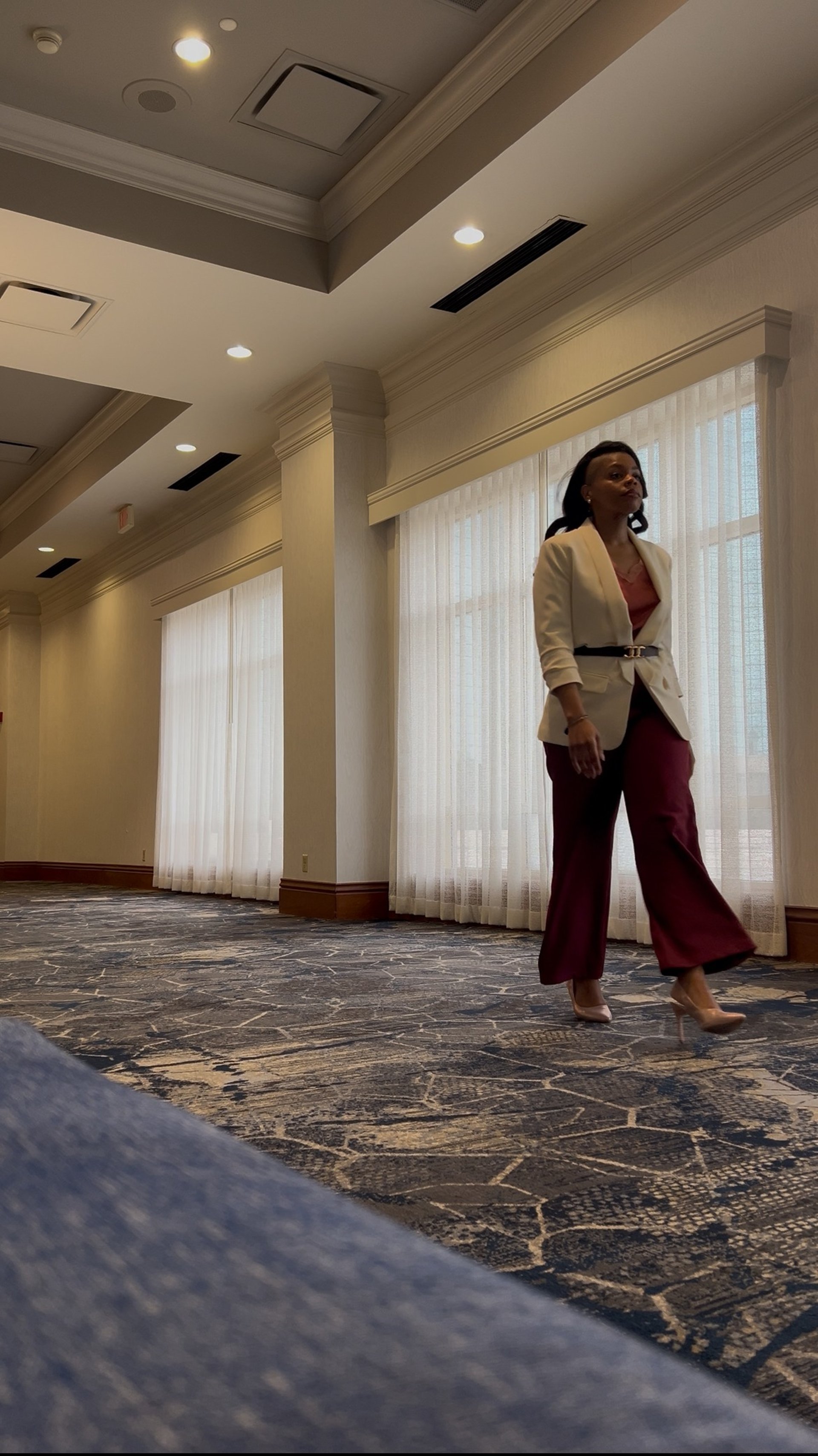 an abstract photo of a curved building with a blue sky in the background