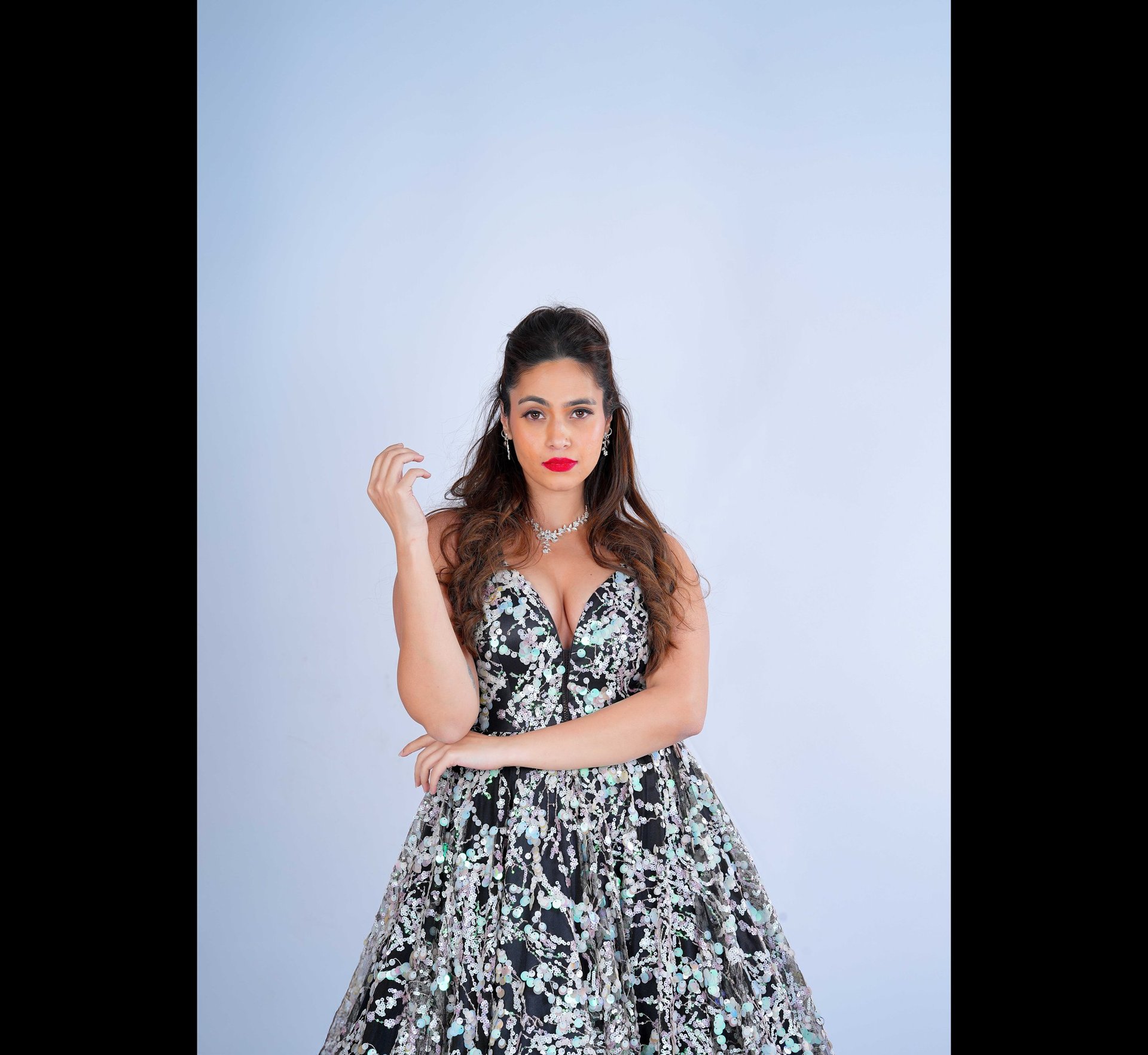 A woman in a red and gold wedding dress