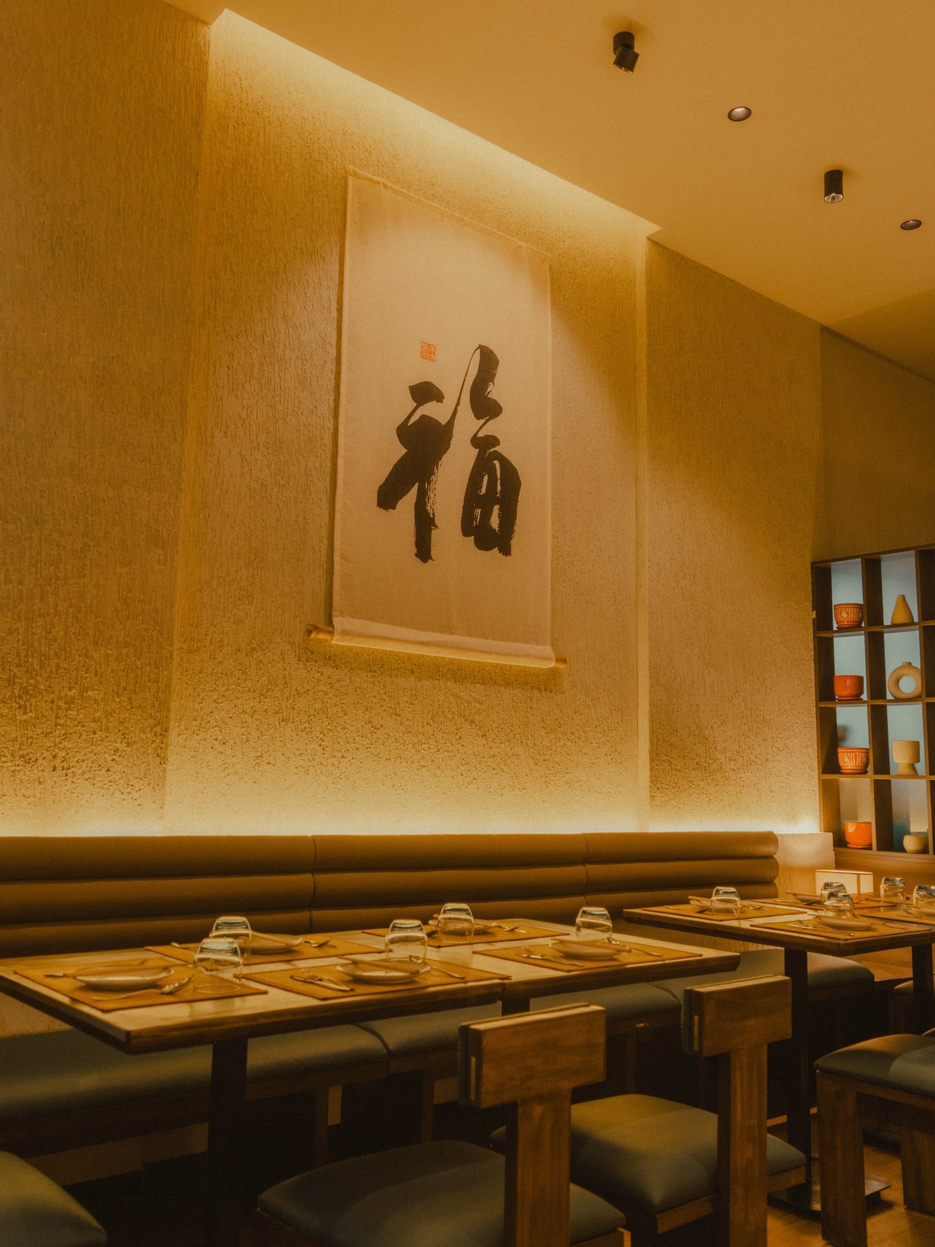 a restaurant with a view of the city at night